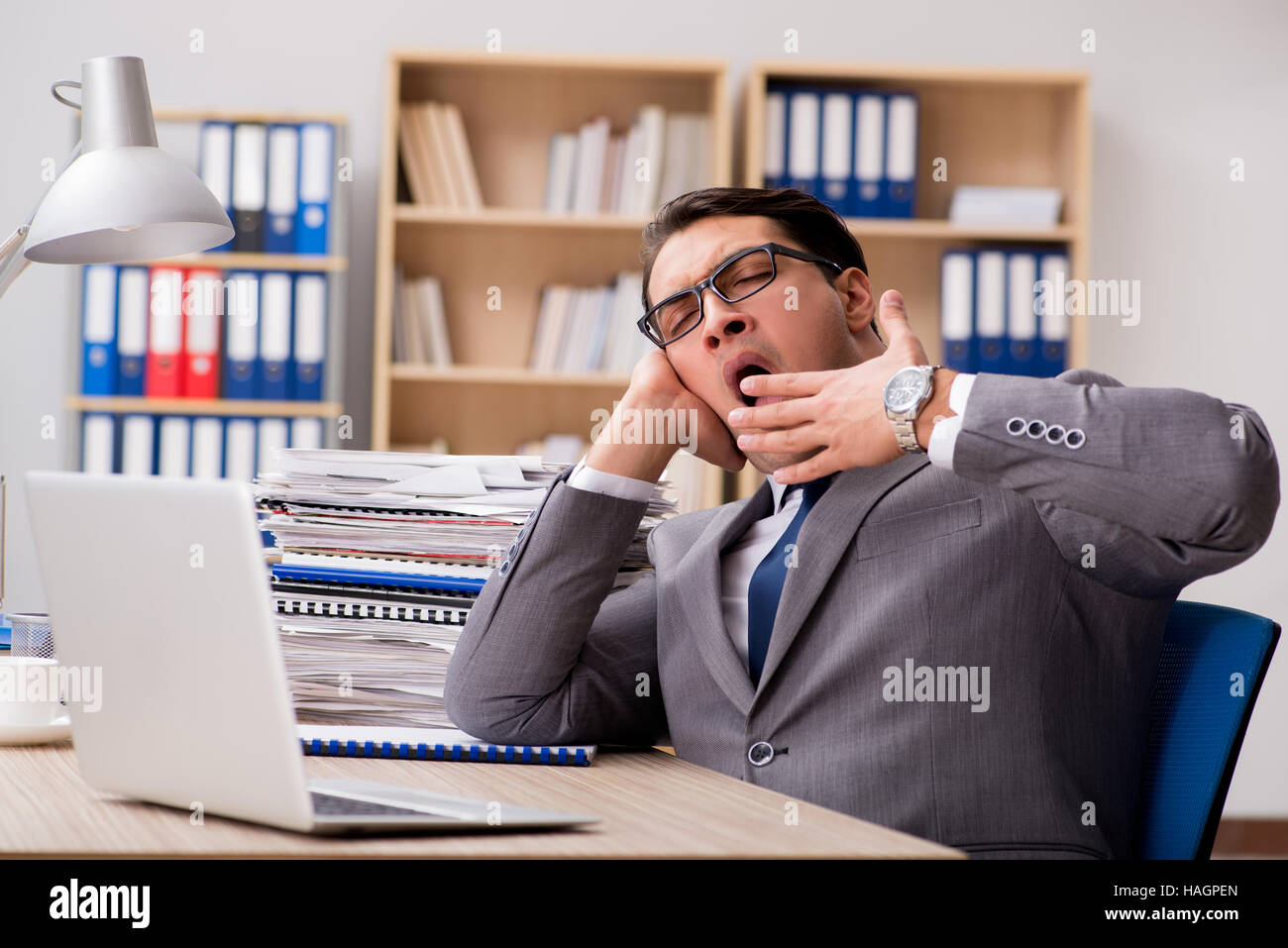 Businessman tired sitting in the office Stock Photo - Alamy