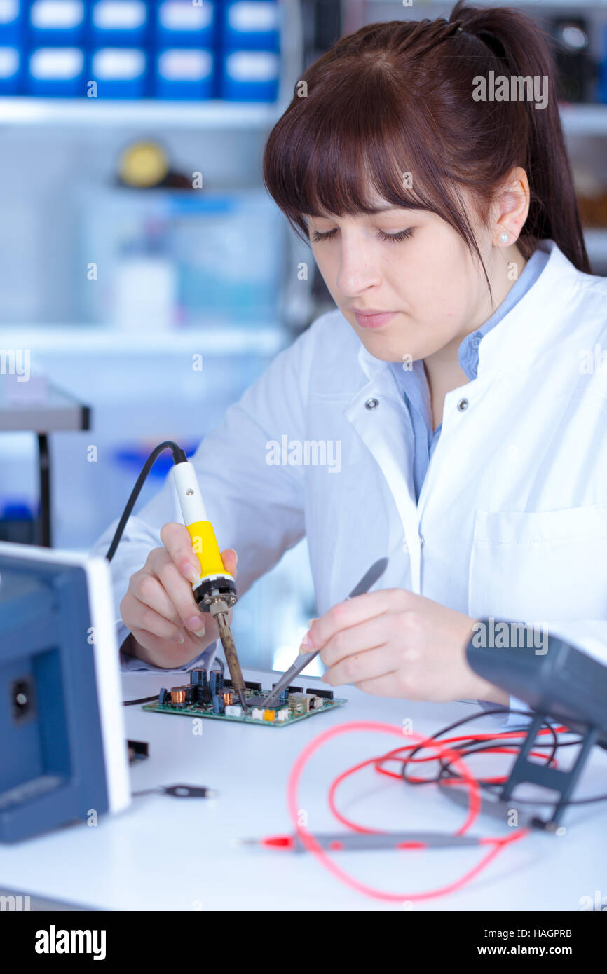 Young woman technician in physics laboratory Stock Photo - Alamy