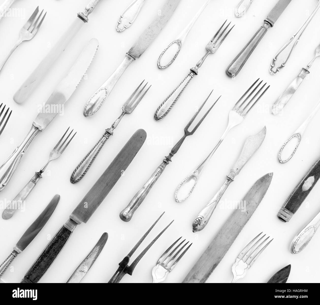 beautiful silver cutlery - vintage flatware isolated on white background -  decorative knife and fork pattern Stock Photo