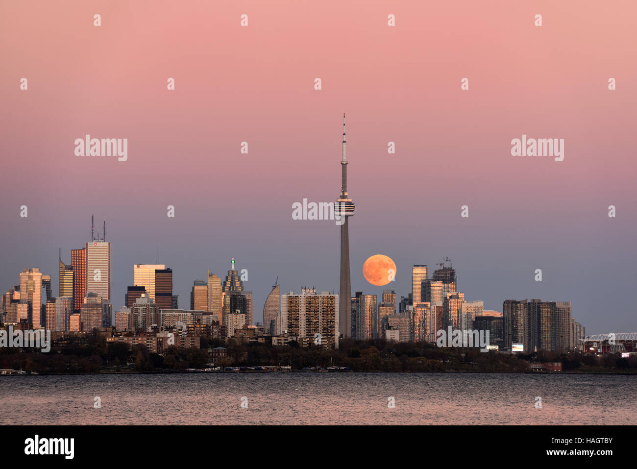 Red supermoon rising over Toronto cityscape on November 13 2016 Stock Photo