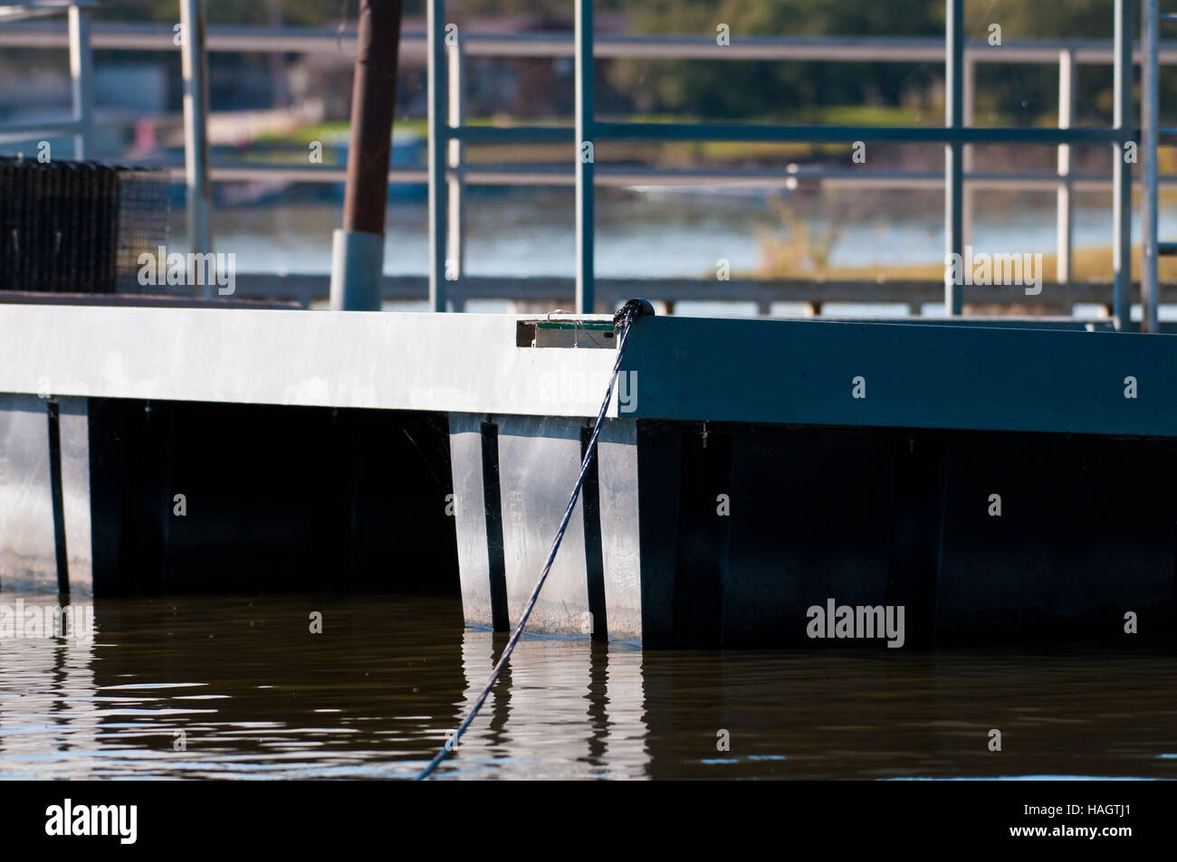 The corner of a metal boat dock on the tranquil lake Stock Photo - Alamy