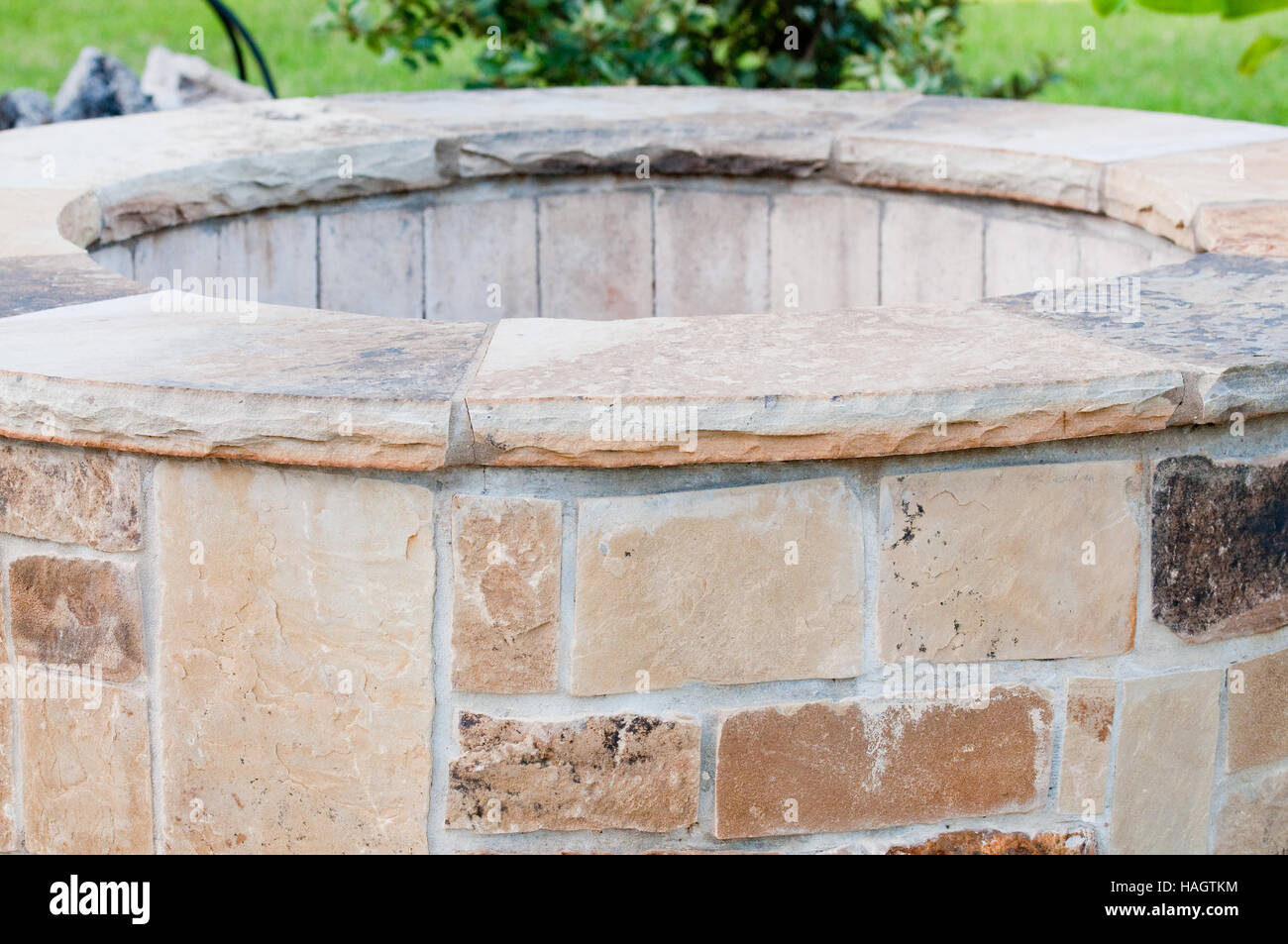 Residential Outdoor Stone Firepit On Concrete Patio Close Up Stock