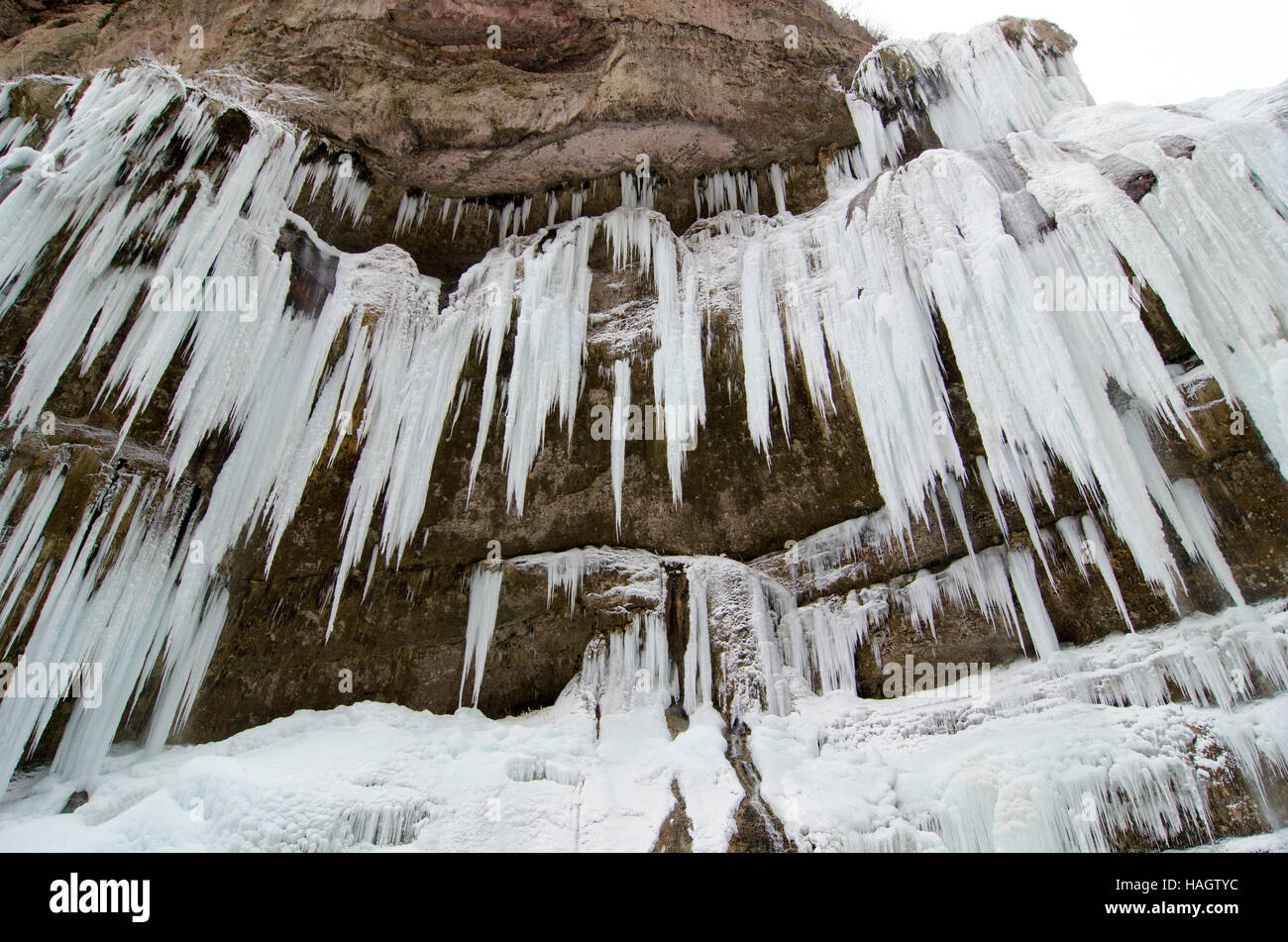 Frozen beautiful waterfall in winter. Icicles and mountain river Stock ...