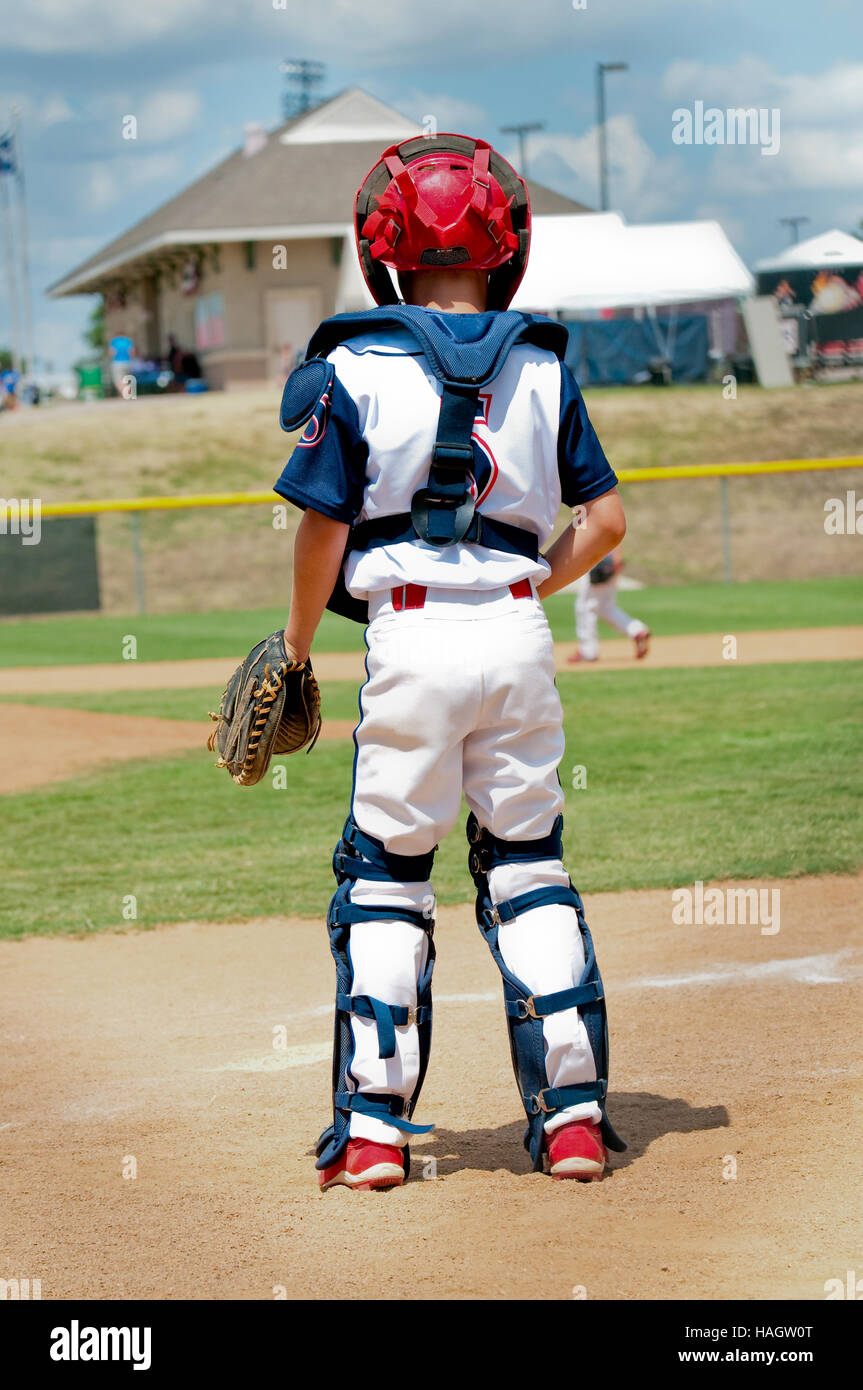 Young baseball player with catching gear on from behind. Stock Photo