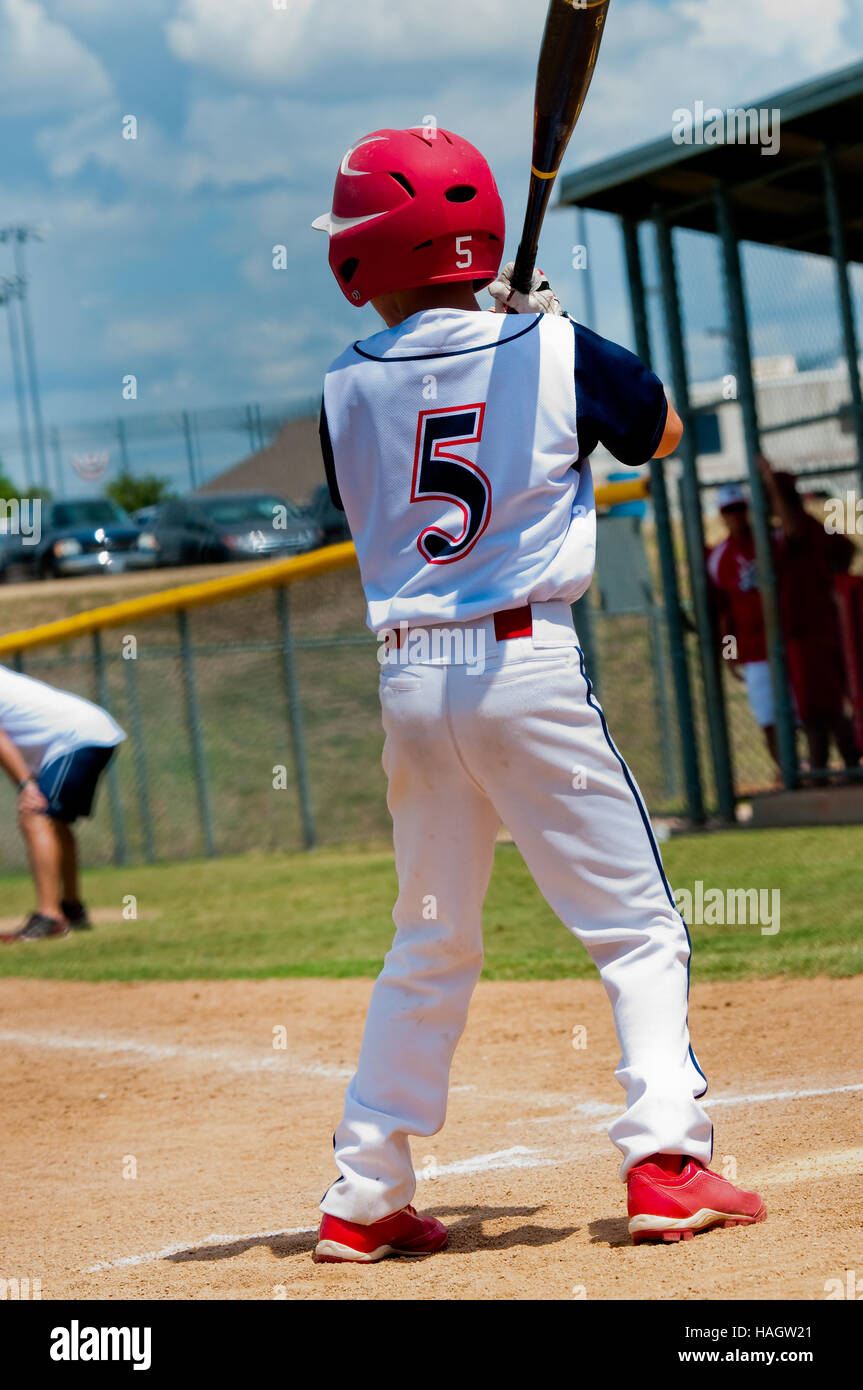 Young baseball player at home plate about to bat. Stock Photo