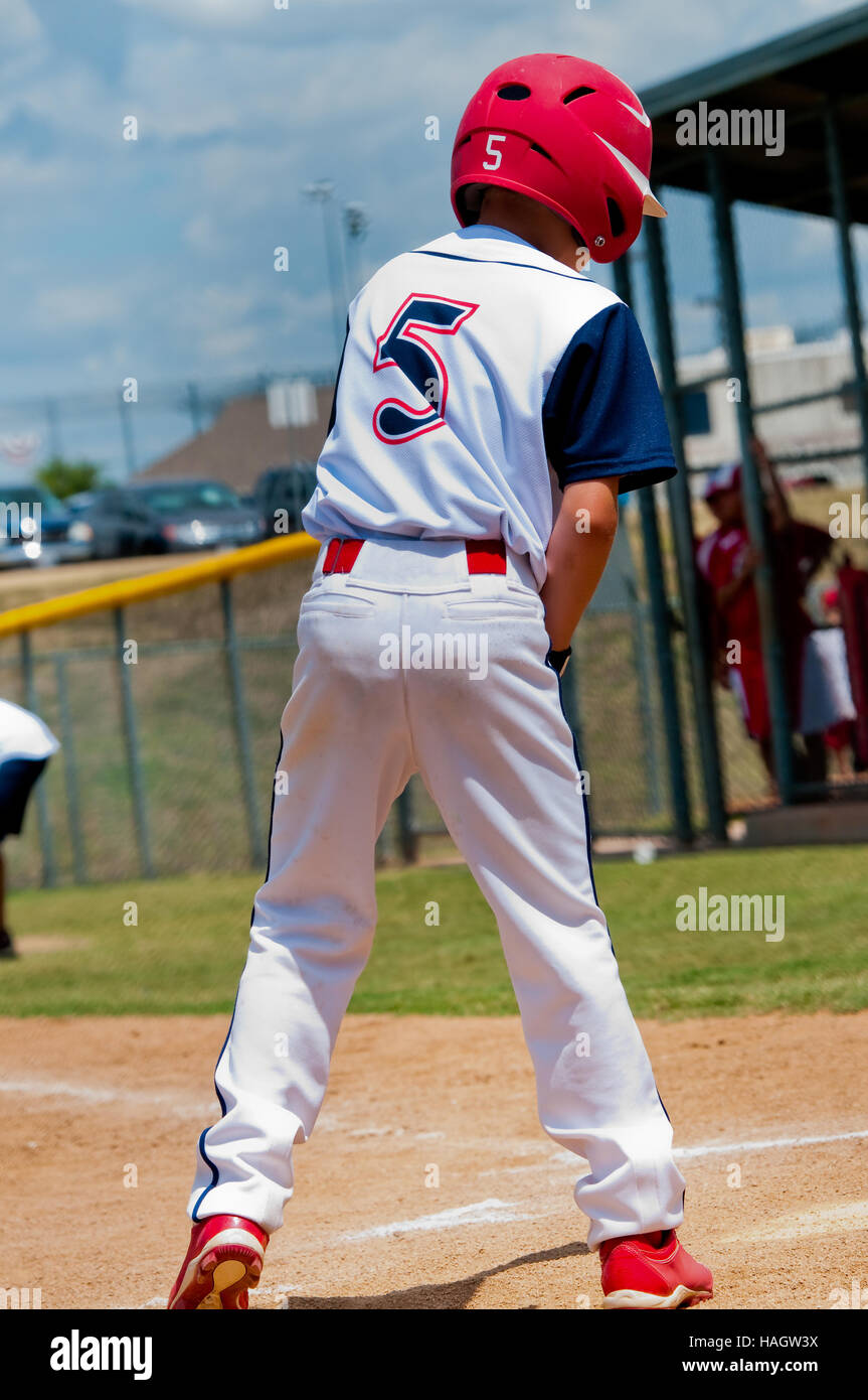 Young baseball player at home plate about to bat. Stock Photo