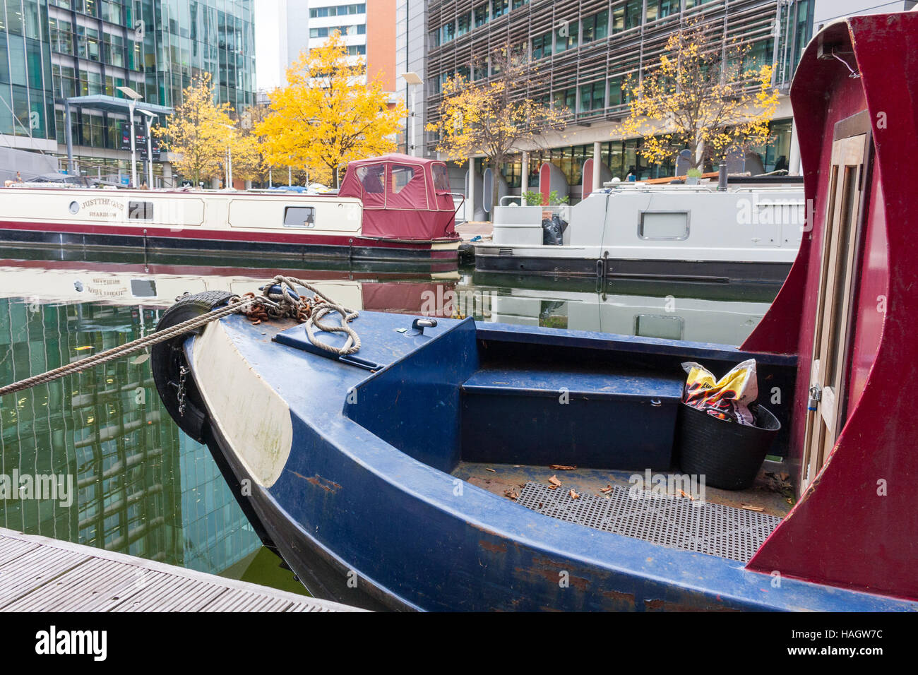 A view of the narrowboats moored up in Grand Union Canal at Paddington Basin, Paddington, London, UK Stock Photo
