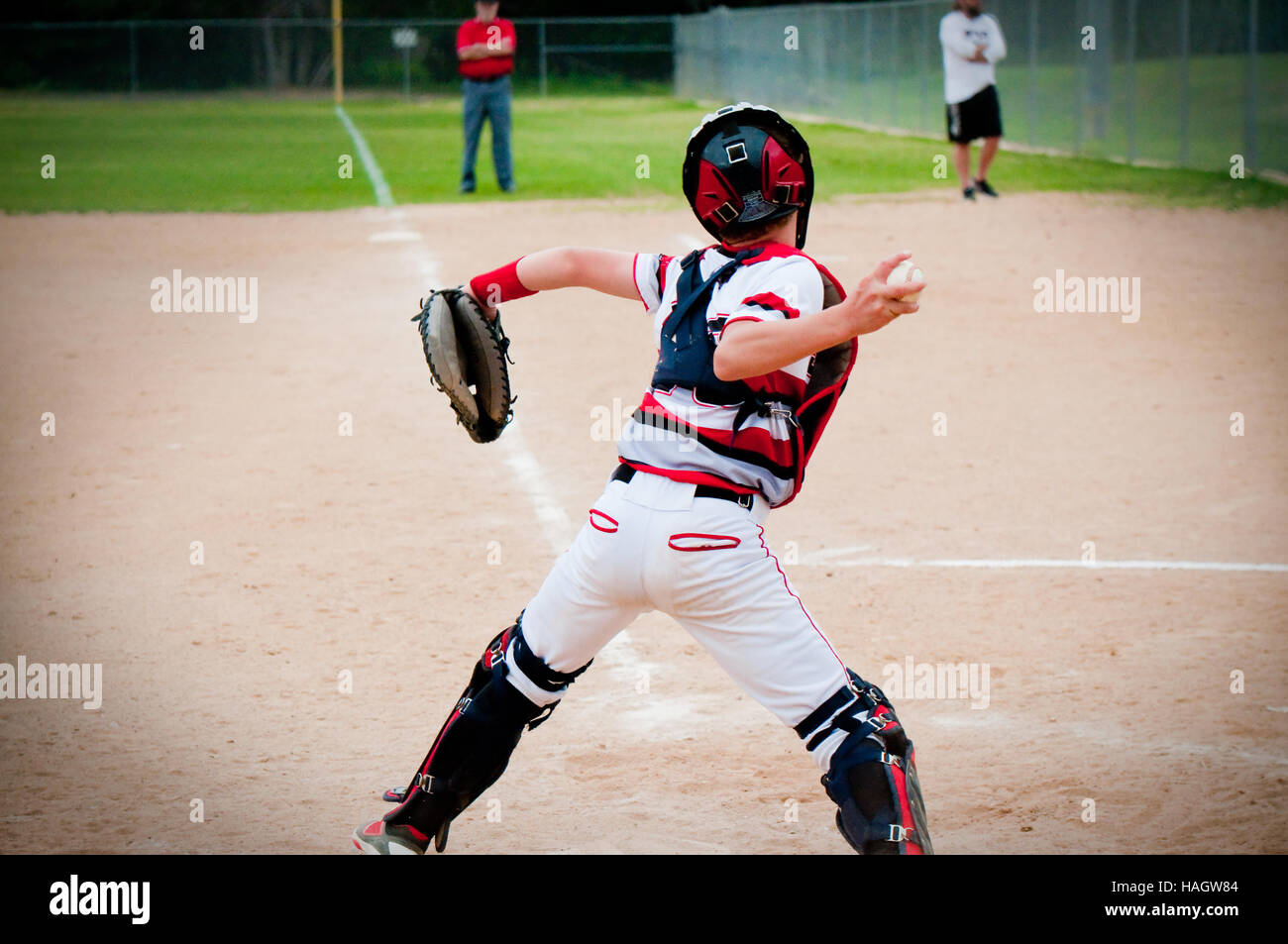 American baseball catcher throwing ball. Stock Photo