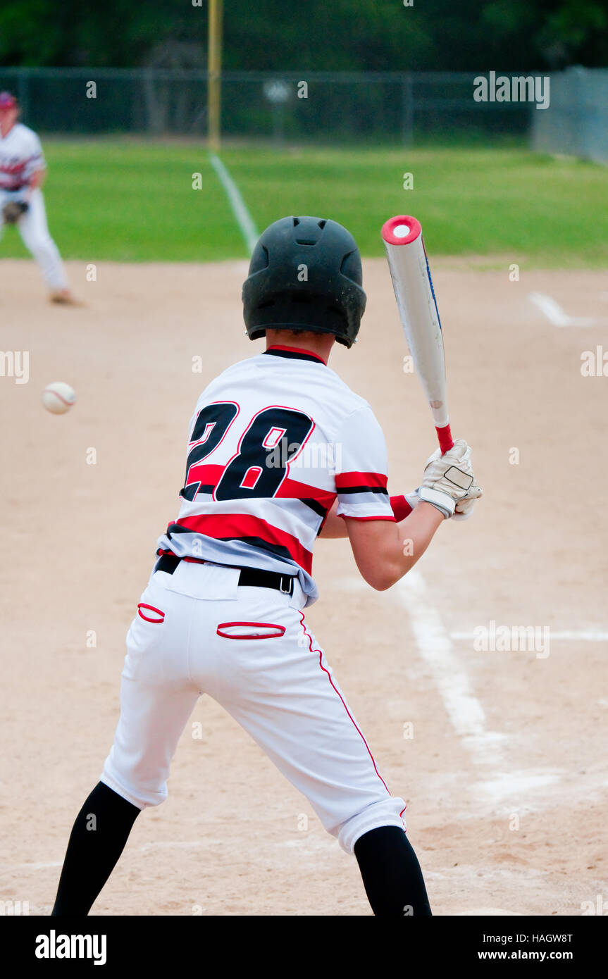American teenage baseball player batting. Stock Photo