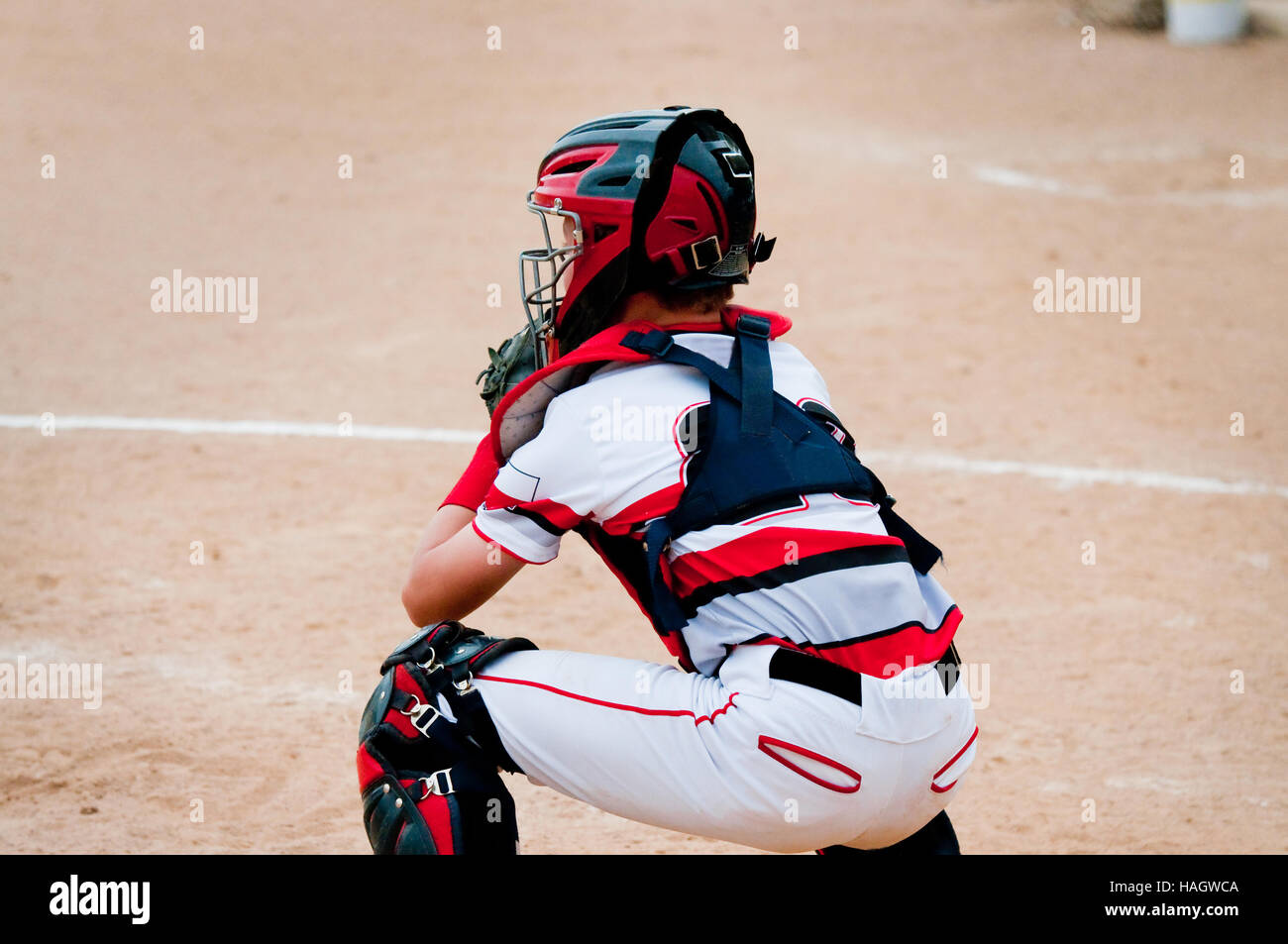 American little league baseball catcher  behind home plate. Stock Photo