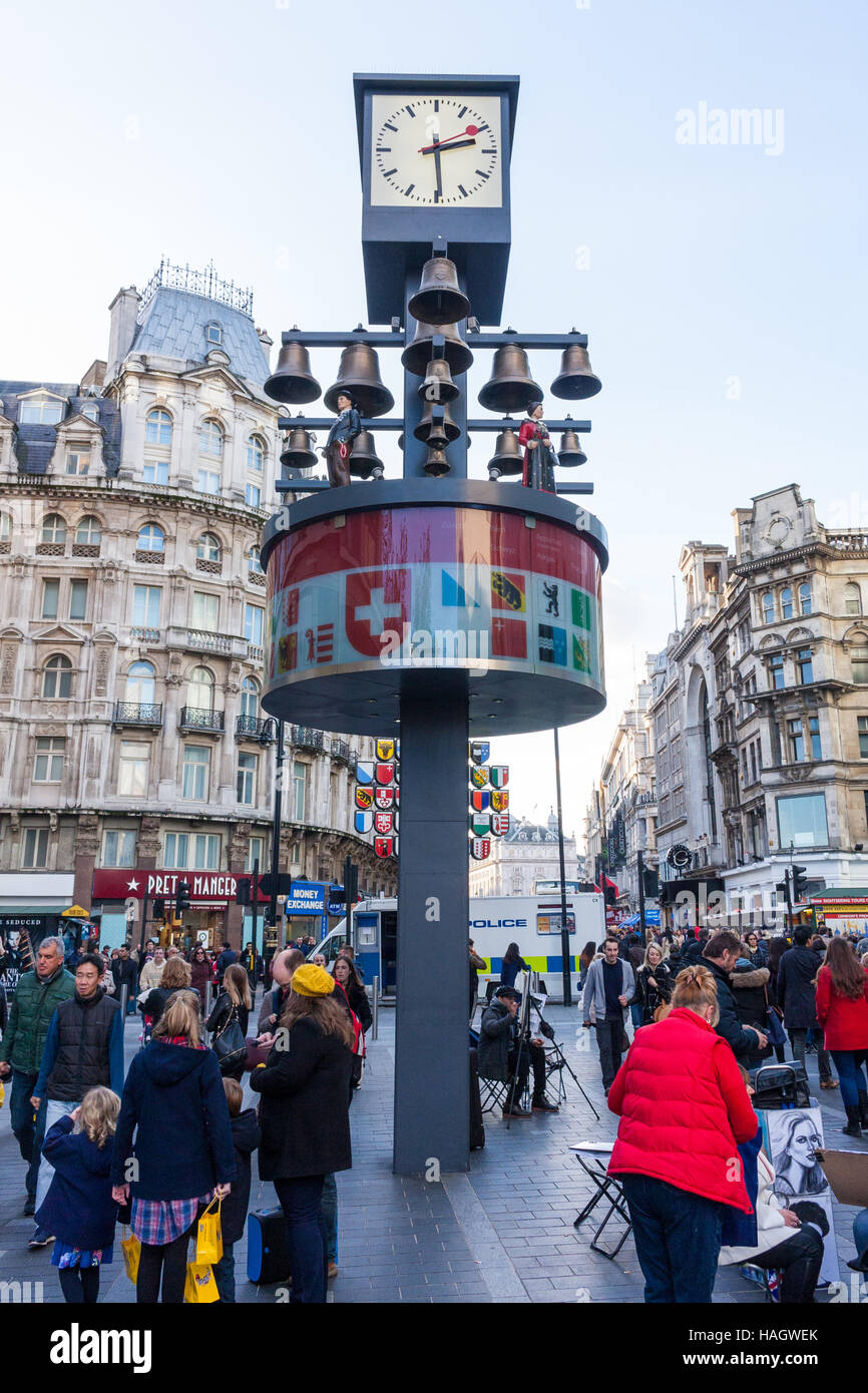 The Swiss Glockenspiel, a musical clock featuring 27 bells and 11 moving Swiss figures, Leicester Square, London, UK Stock Photo