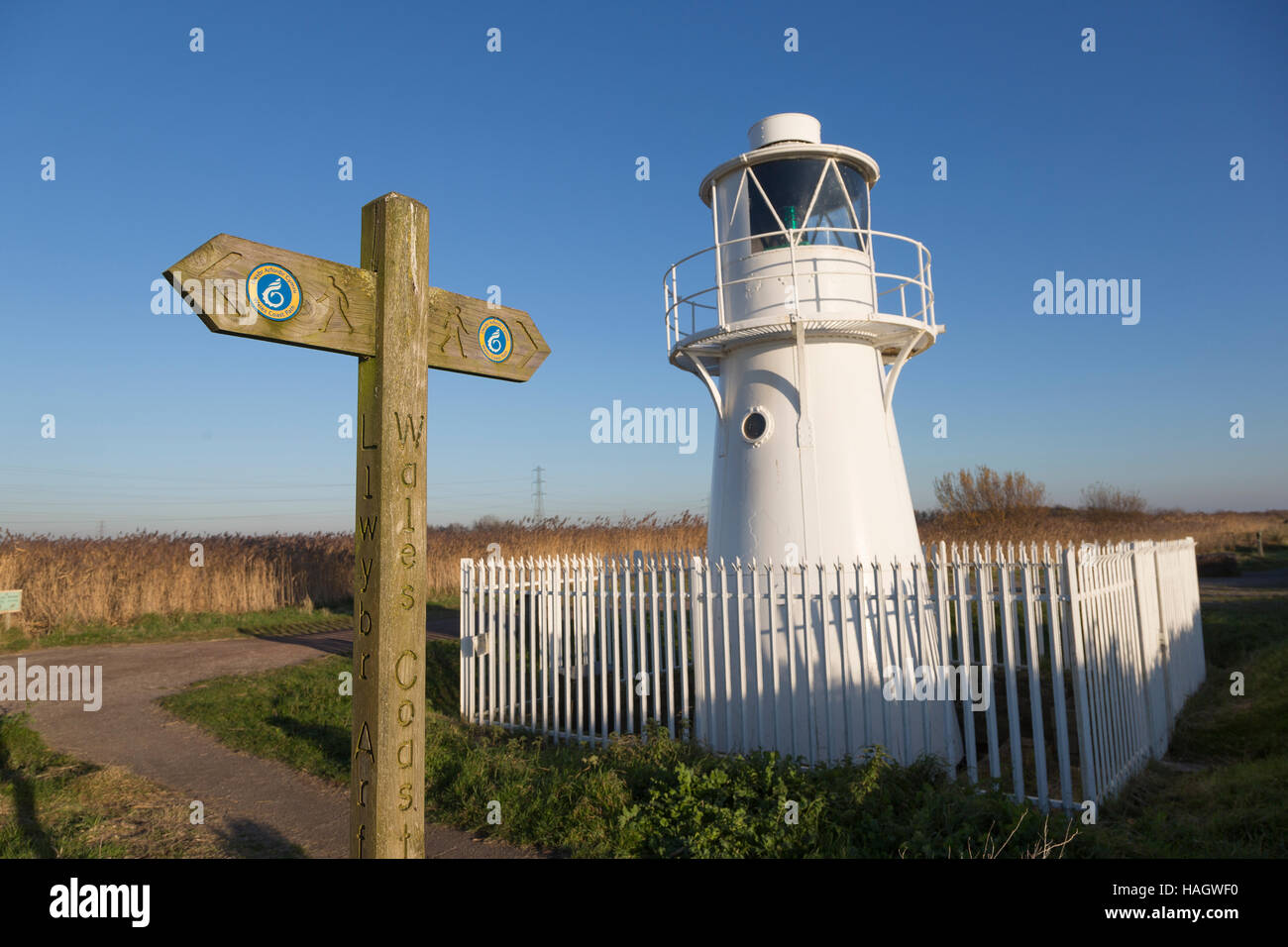 Wales Coast Path, signpost and East Usk lighthouse, at Newport Wetlands. Stock Photo