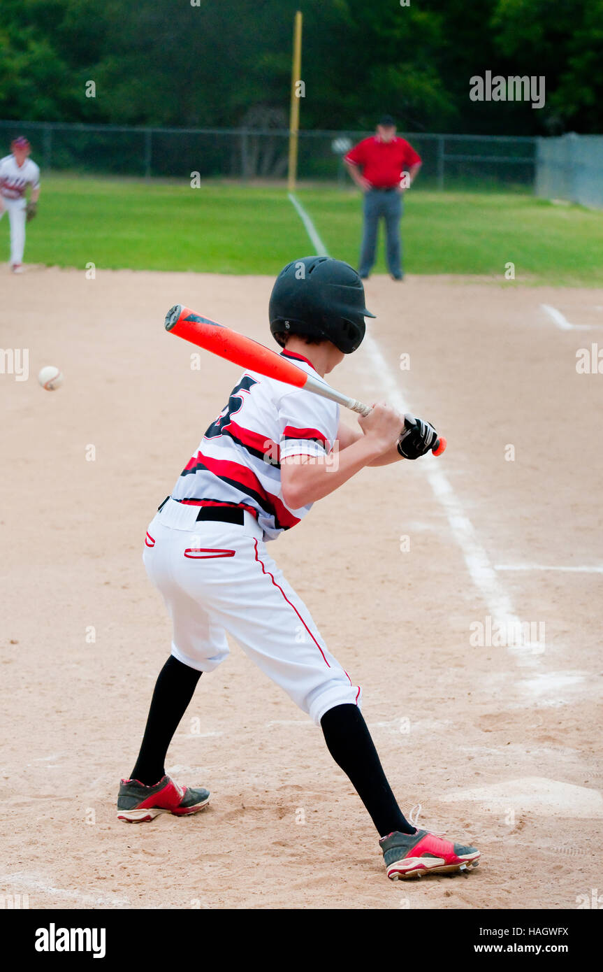 American teenage baseball player batting. Stock Photo