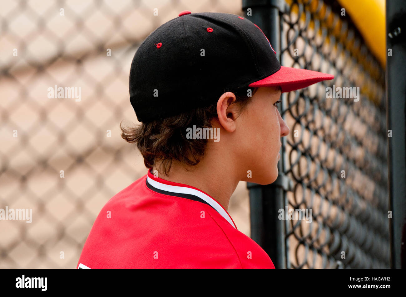 Profile of American baseball player close up in the dugout. Stock Photo