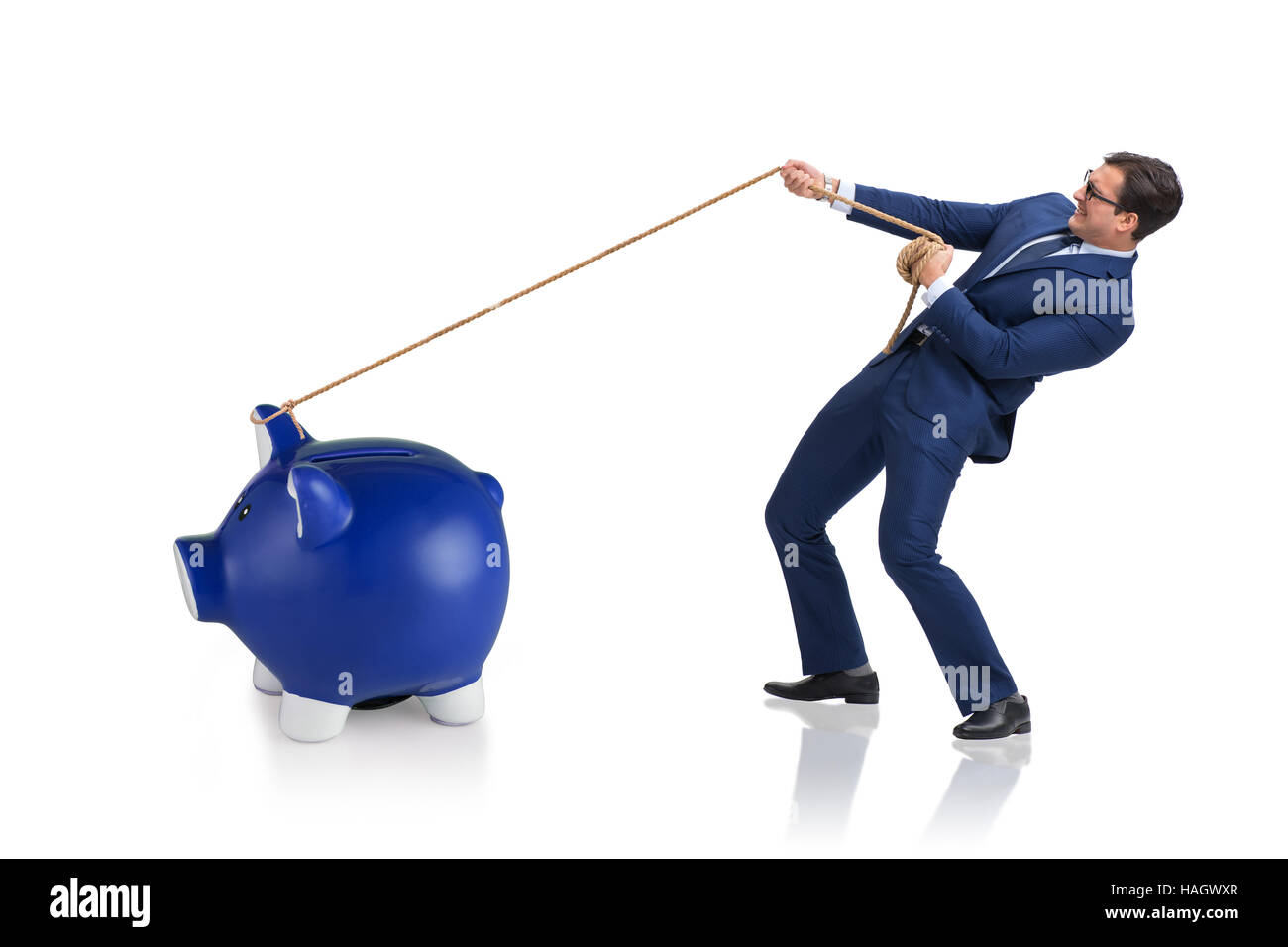 Businessman pulling piggybank with rope Stock Photo - Alamy