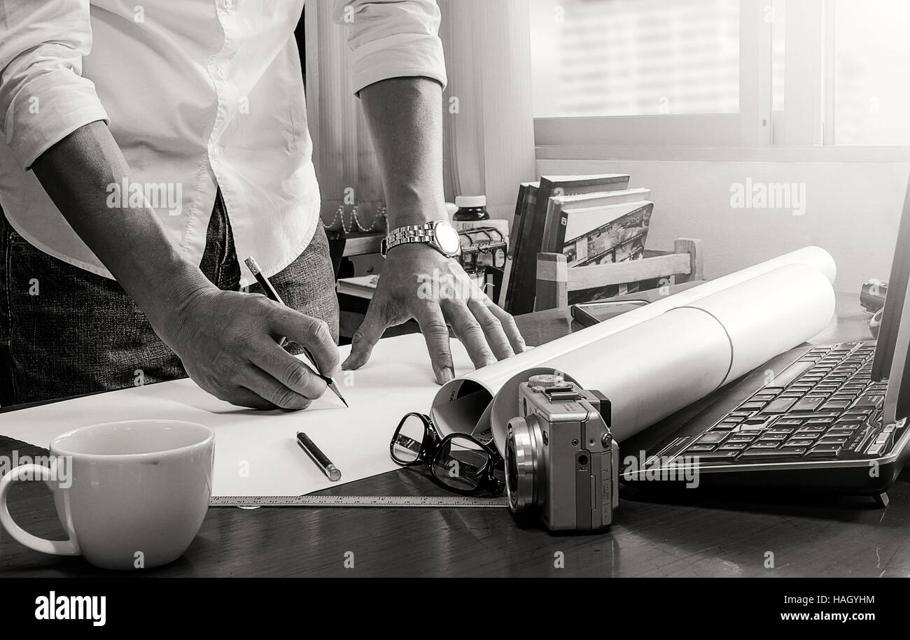 man working on his plane project at the office.Black and white design. Stock Photo