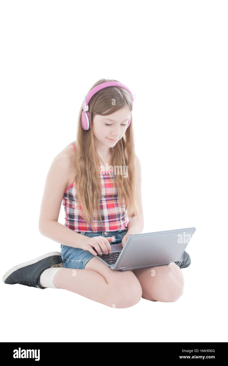 portrait of the young beautiful girl working at the computer on a white ...
