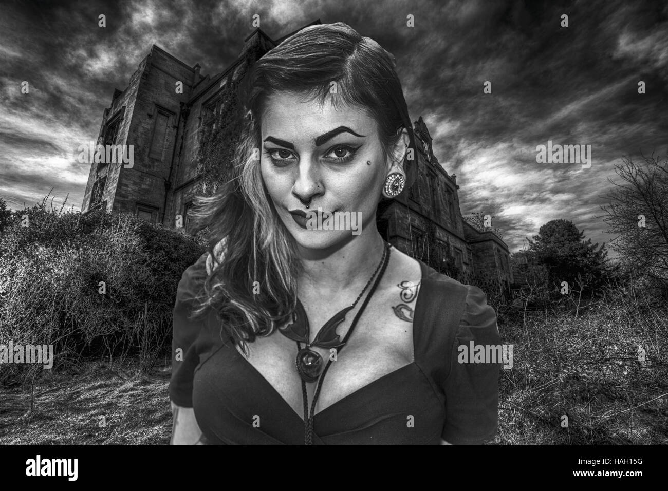 Gothic girl, goth girl, black and white, pretty girl, dark, mysterious, buxom, alternative girl, tattoo, tattooed,  UK England GB Stock Photo