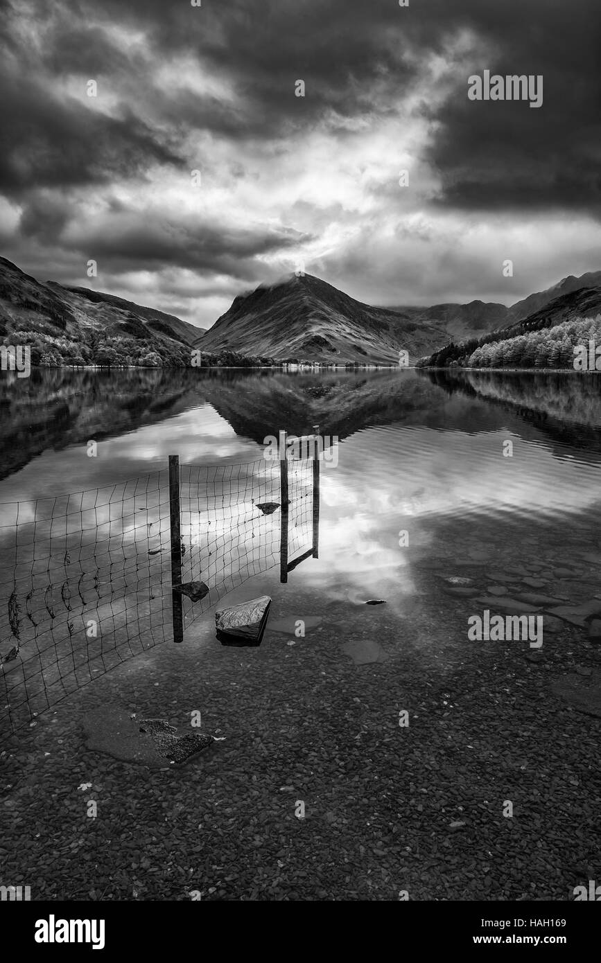 Stunning black and white Autumn Fall landscape image of Lake Buttermere in Lake District England Stock Photo