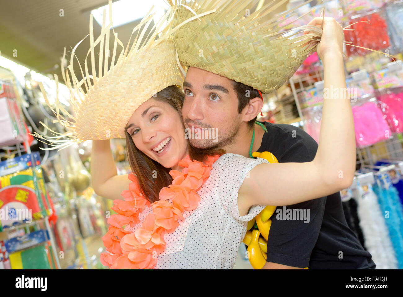 portrait of happy couple having fun trying costumes Stock Photo - Alamy