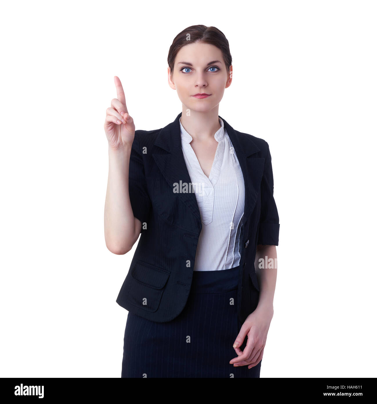 Smiling businesswoman standing over white isolated background Stock Photo