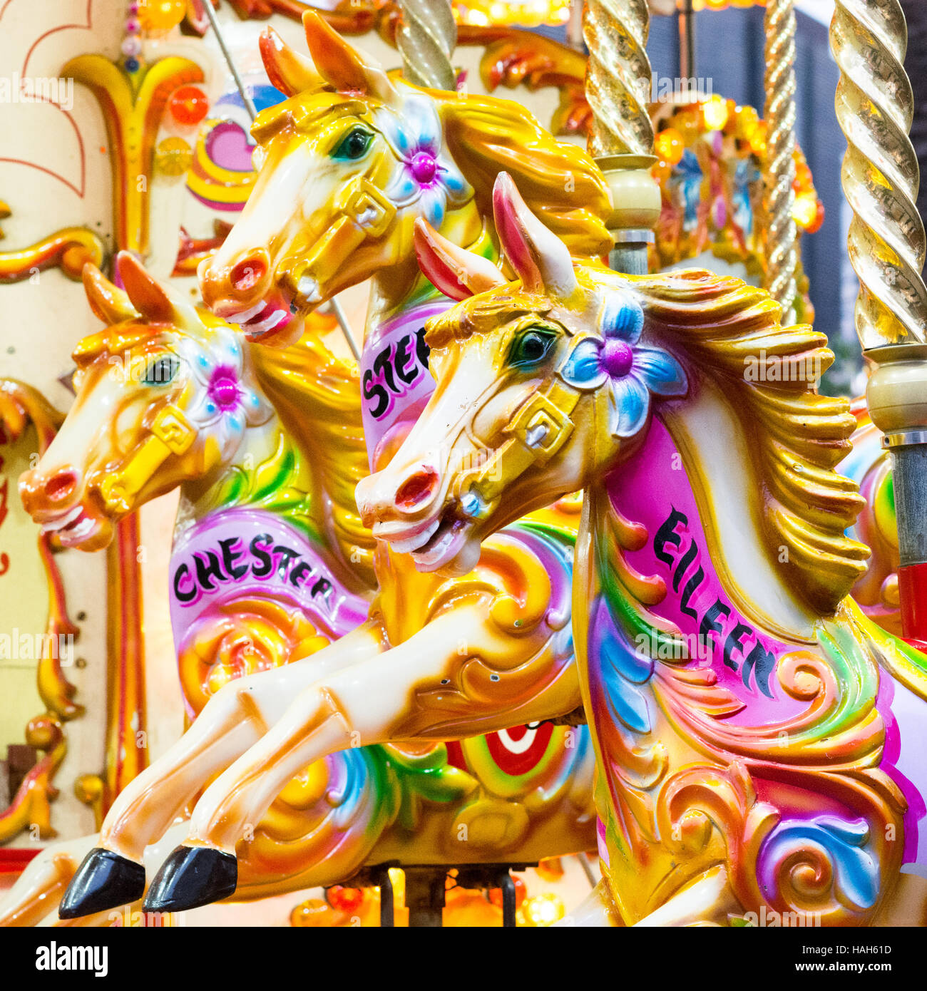Colourful horses on a fairground carousel ride Stock Photo Alamy