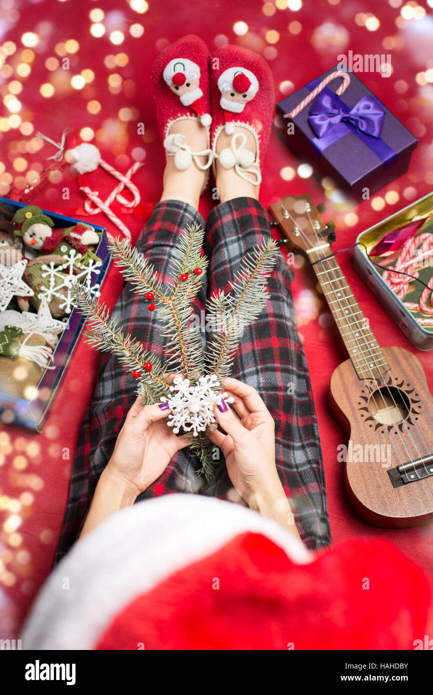 girl holding a pine branch and christmas decorations Stock Photo