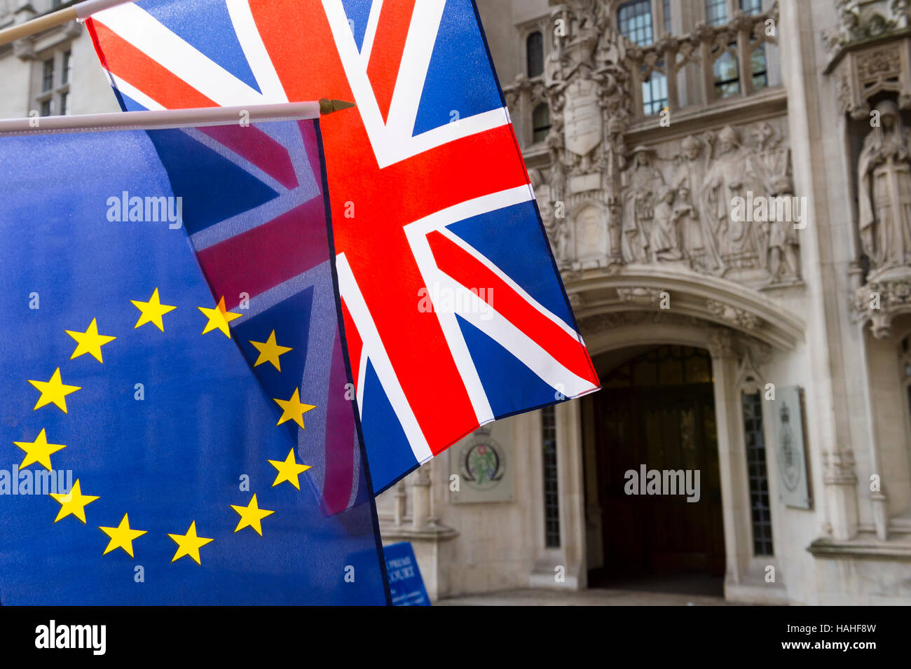 EU and Union Jack flags flying in front of The Supreme Court of the United Kingdom in the public Middlesex Guildhall in London Stock Photo