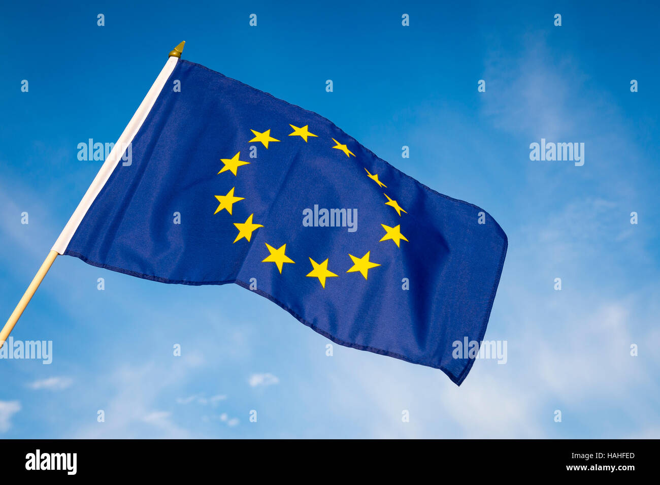 European Union flag flying in front of bright blue sky Stock Photo