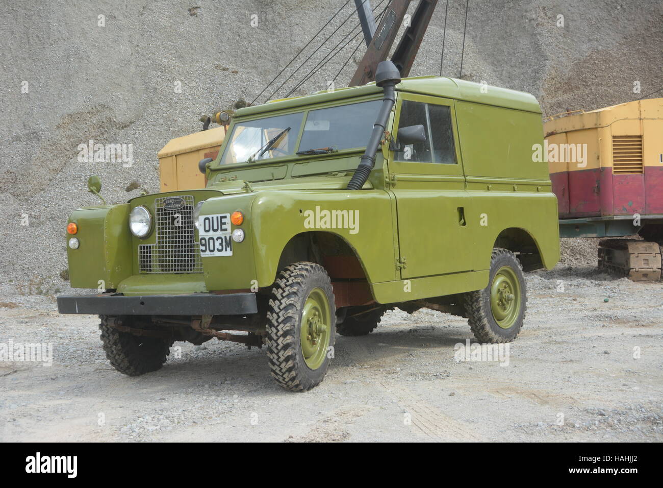 Land rover and cranes in a quarry Stock Photo