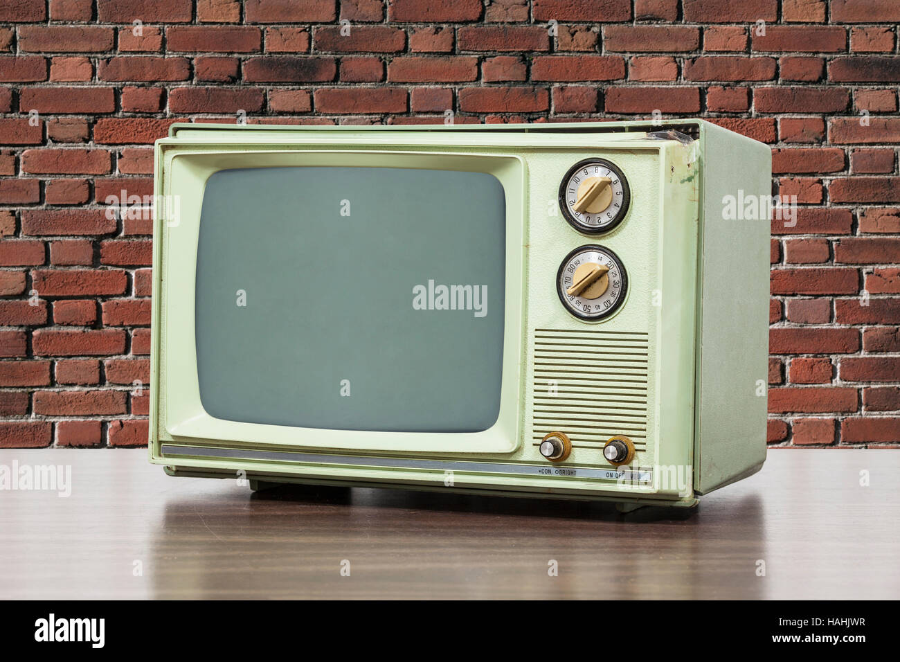 Green vintage television with brick wall Stock Photo Alamy