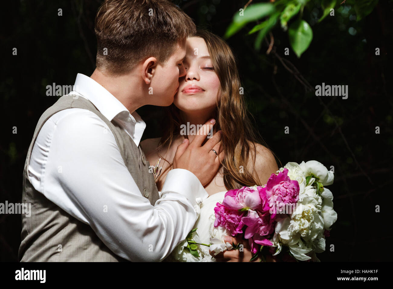 Wedding dress flowers kissing hi-res stock photography and images - Alamy