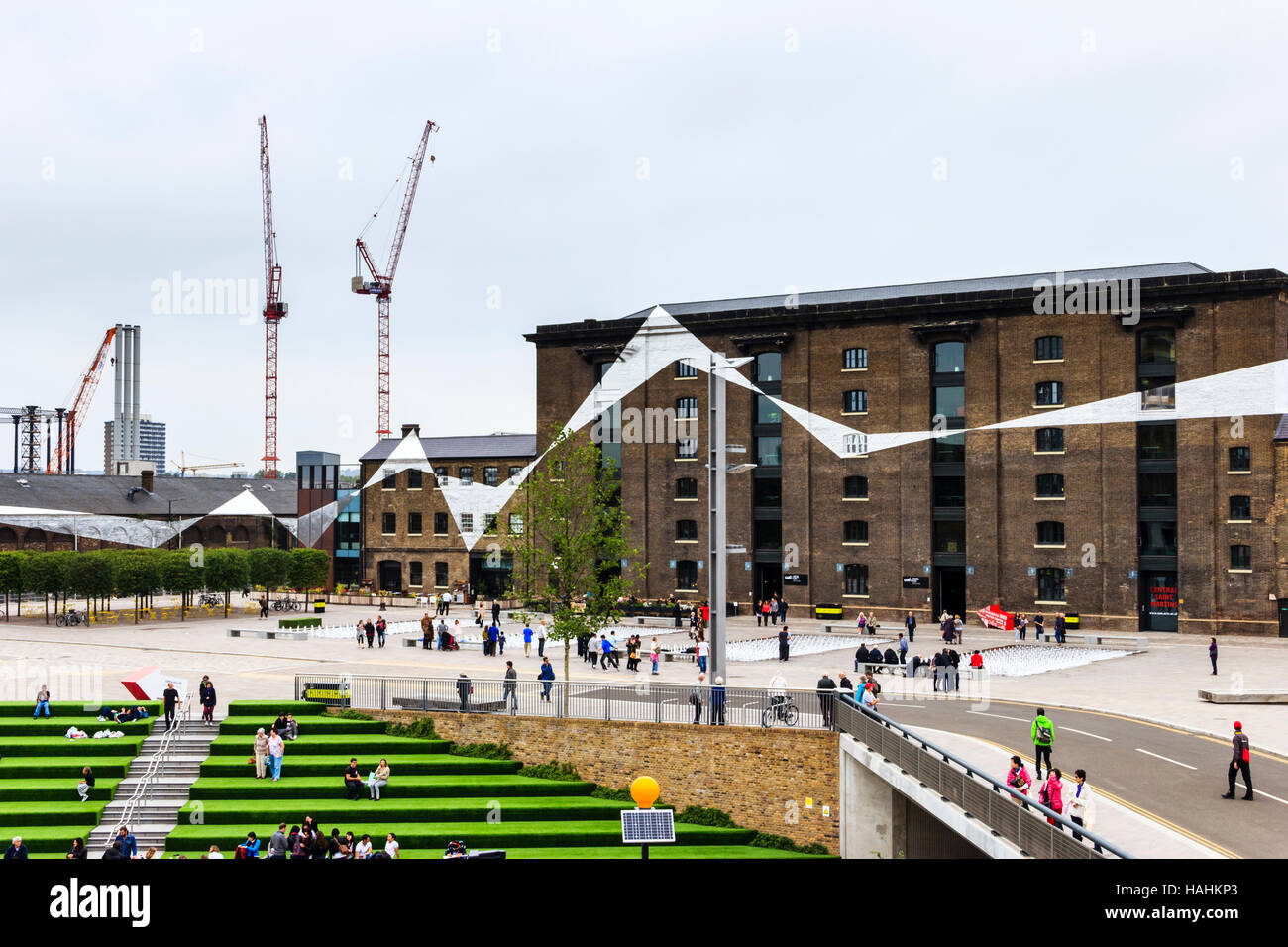 The steps of Granary Square, covered with artificial grass, during the redevelopment of King's Cross, London, UK, 2013 Stock Photo