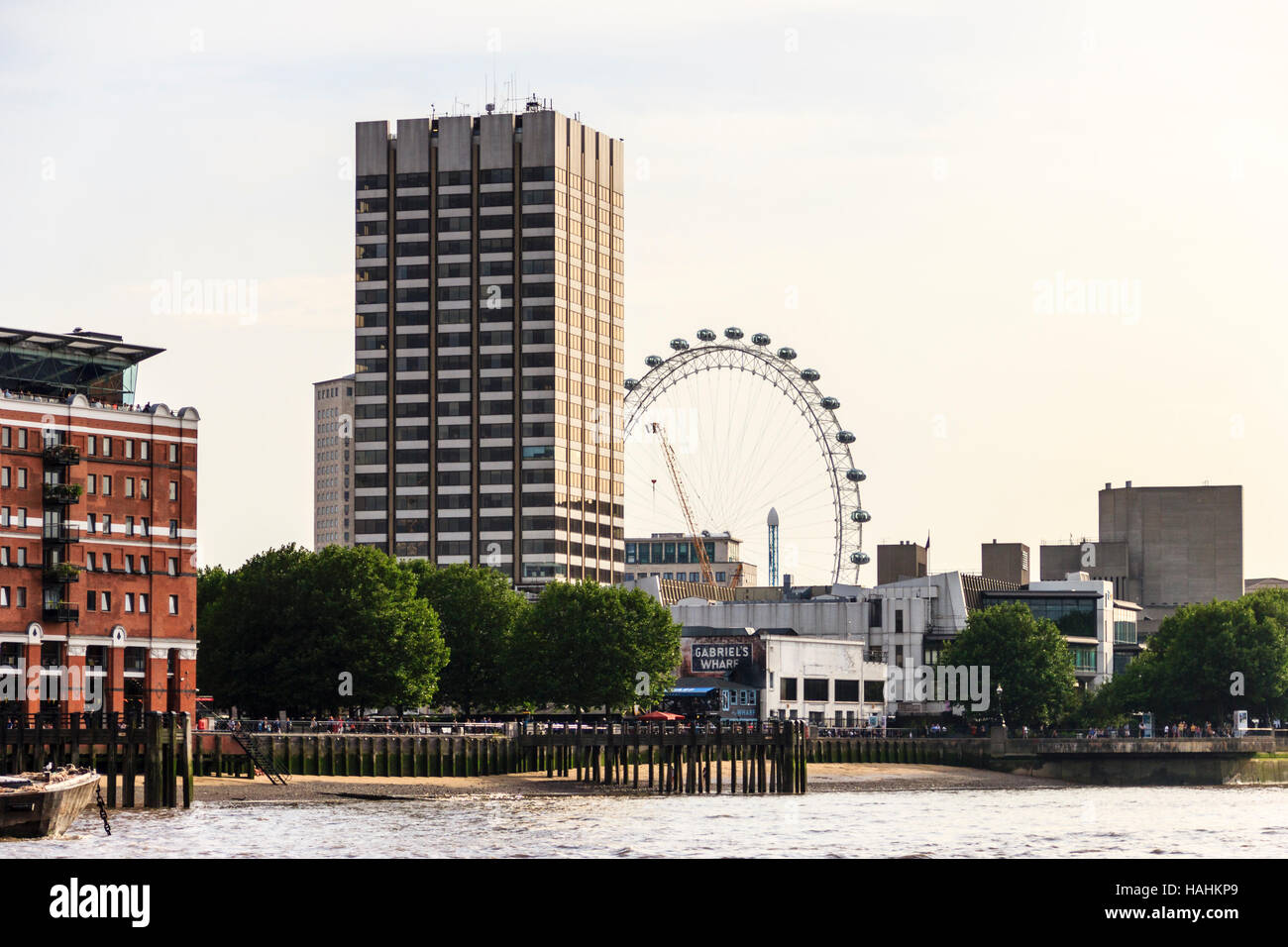 Gabriel's Wharf on the south bank of the River Thames, London, UK, the London Eye in the background Stock Photo