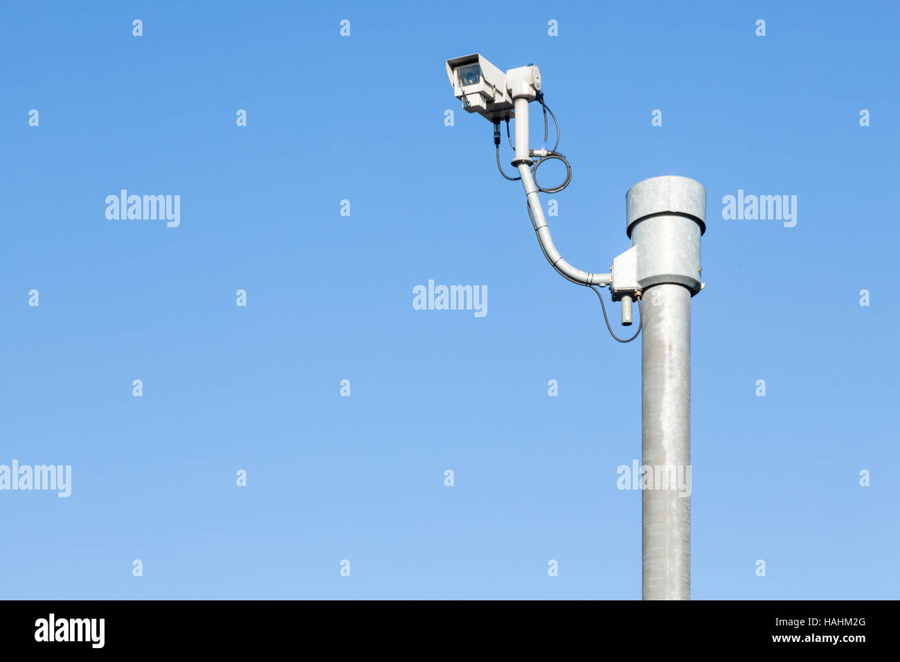 Surveillance. CCTV camera against a blue sky, Nottingham, England, UK