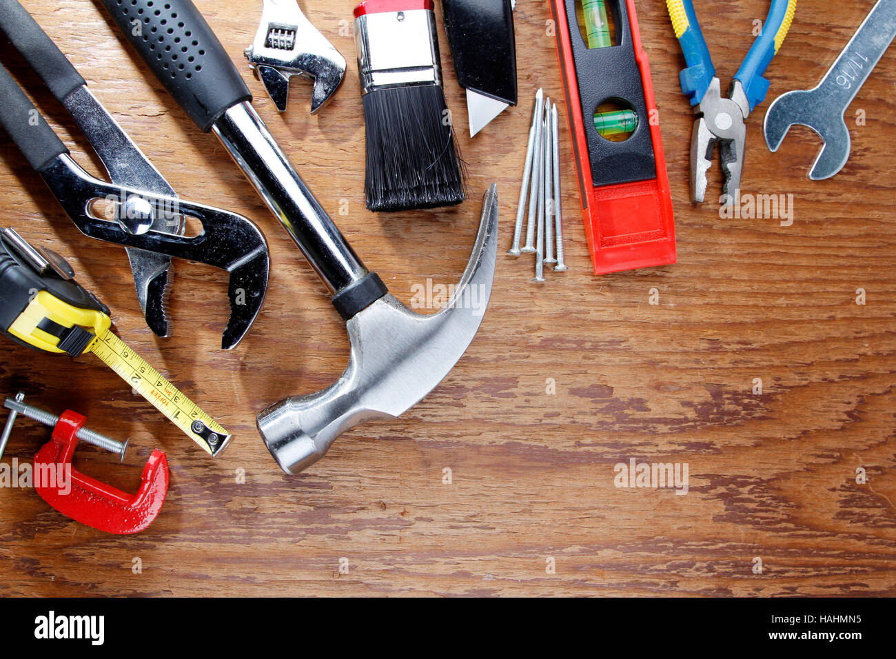 Assorted work tools on wood Stock Photo Alamy