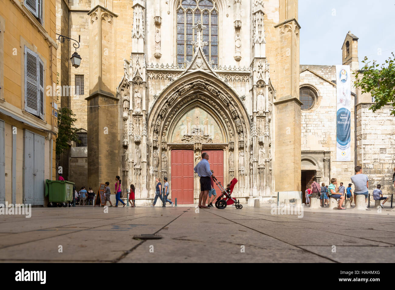 Aix en provence,France-August 9,2016:people and tourist stroll and admire the Aix cathedral of Saint Sauveur during a sunny day. Stock Photo