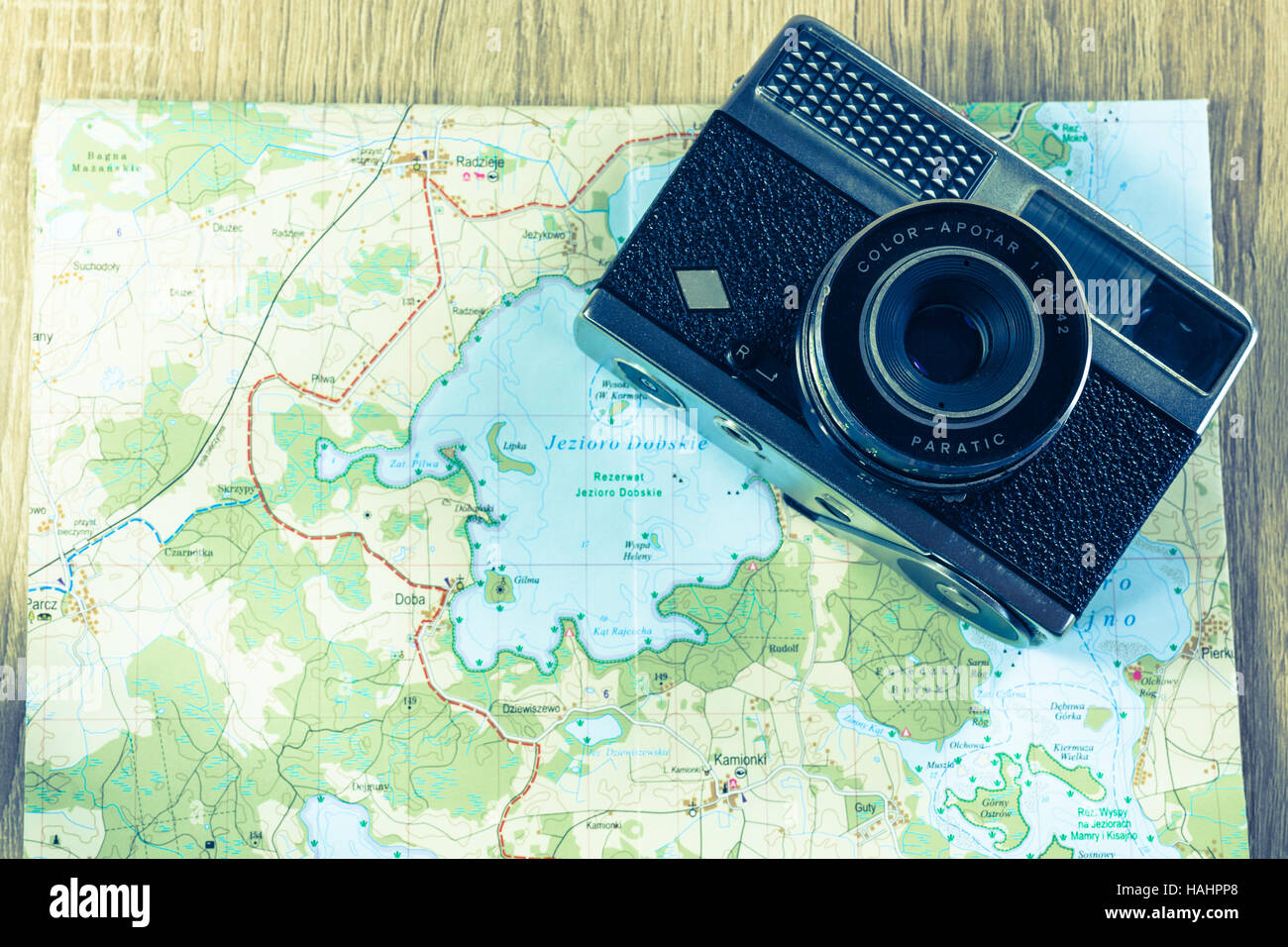 Old agfa camera on a map of lakes in Poland. Obsolete camera on a map. Bleach photo Stock Photo