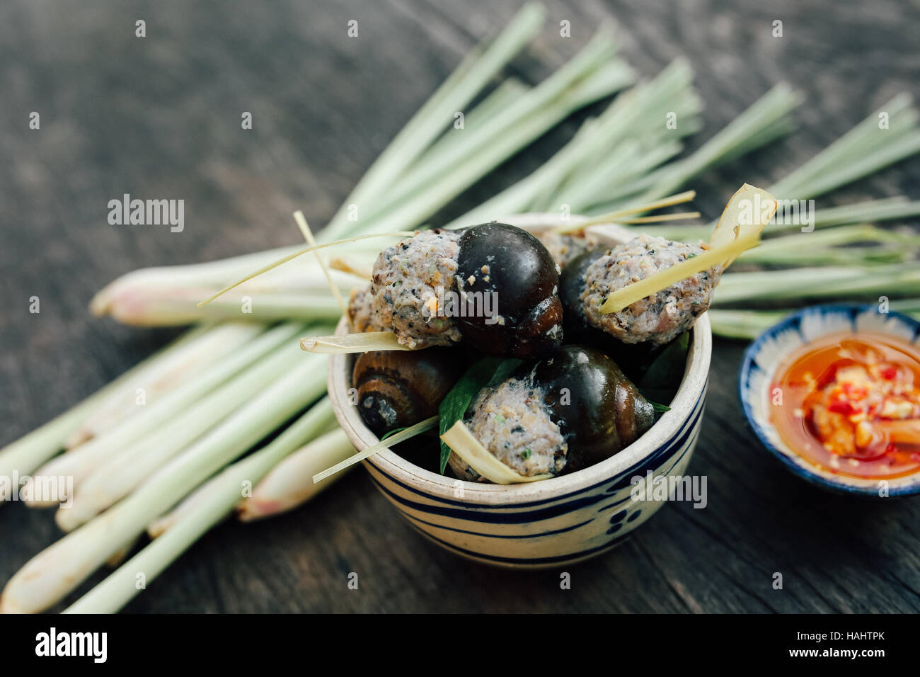 Steamed Vietnamese snails stuffed with pork meat and lemongrass, fish