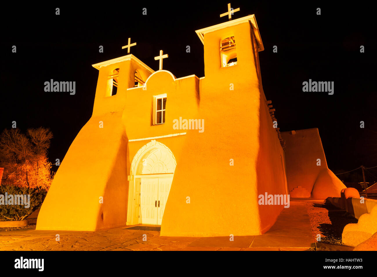 Night view of illuminated San Francisco de Asis church in Taos, New Mexico Stock Photo