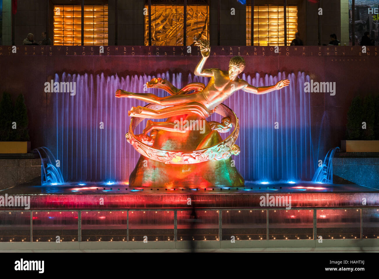 Manhattan, Rockefeller Center, New York City, NY, USA - Prometheus Sculpture by Paul Mansing and fountain illuminated at night. Stock Photo