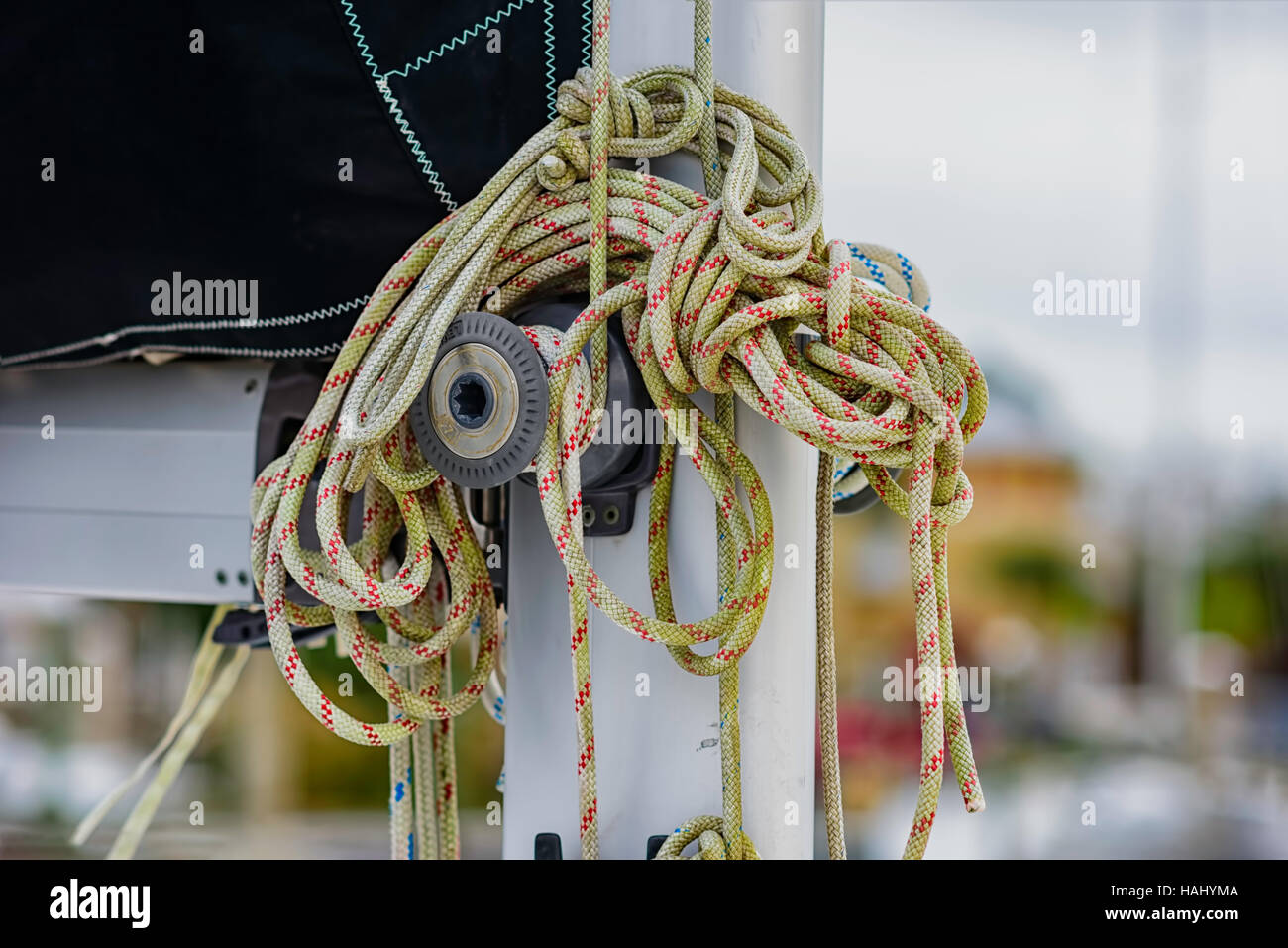 coiled rope on sailboat pulley Stock Photo