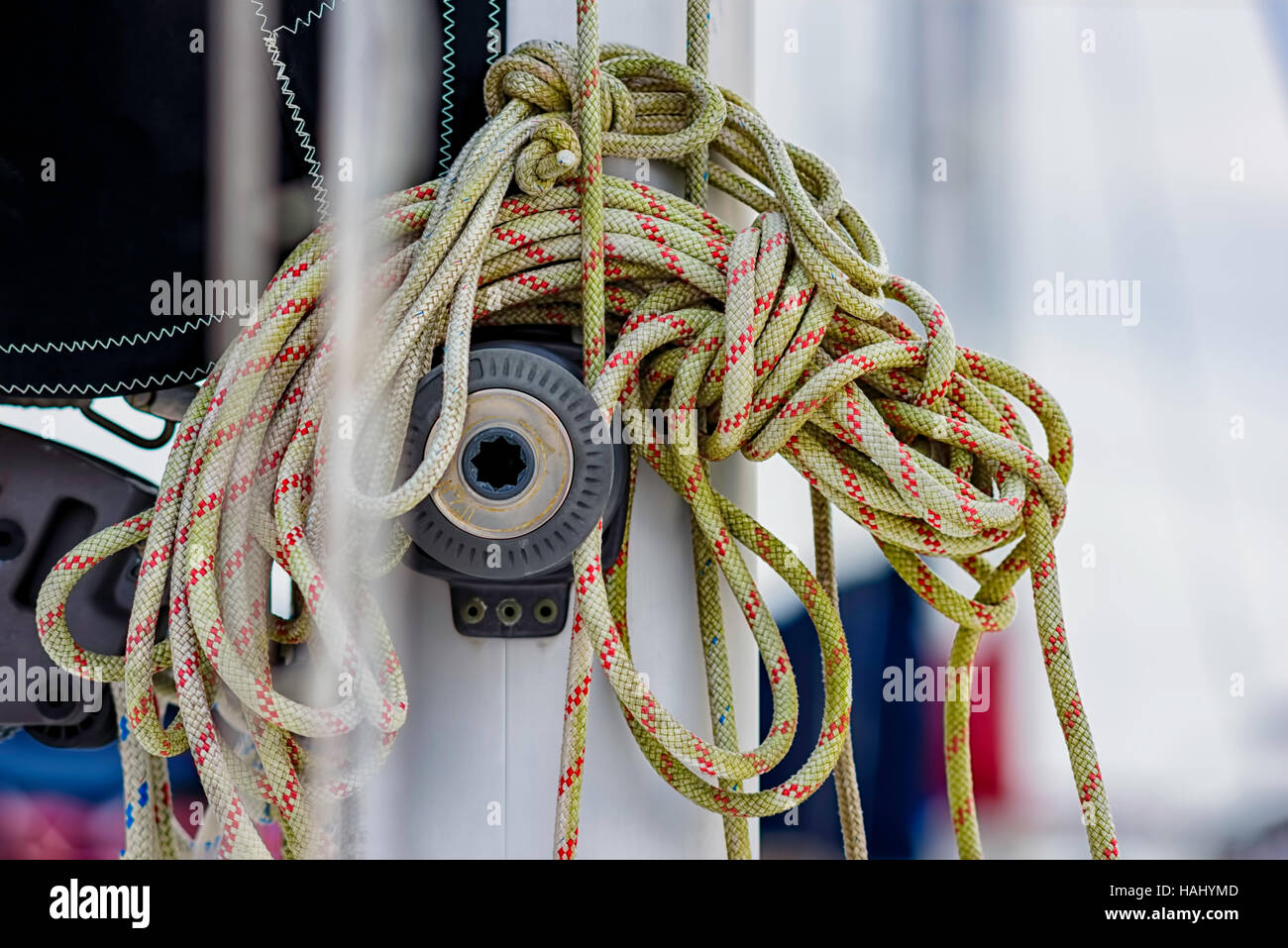 coiled rope on sailboat pulley Stock Photo - Alamy