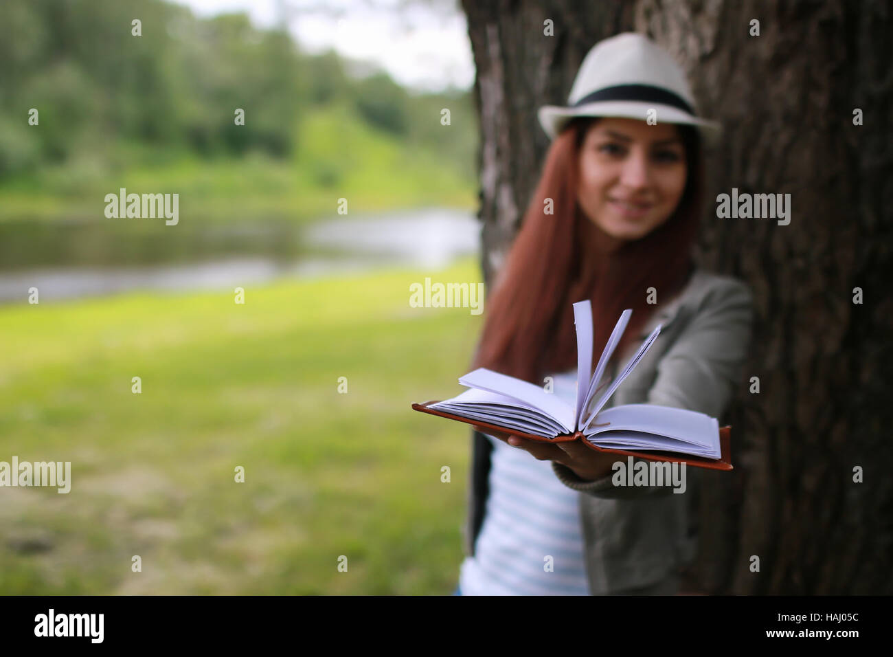 girl with book in park Stock Photo - Alamy