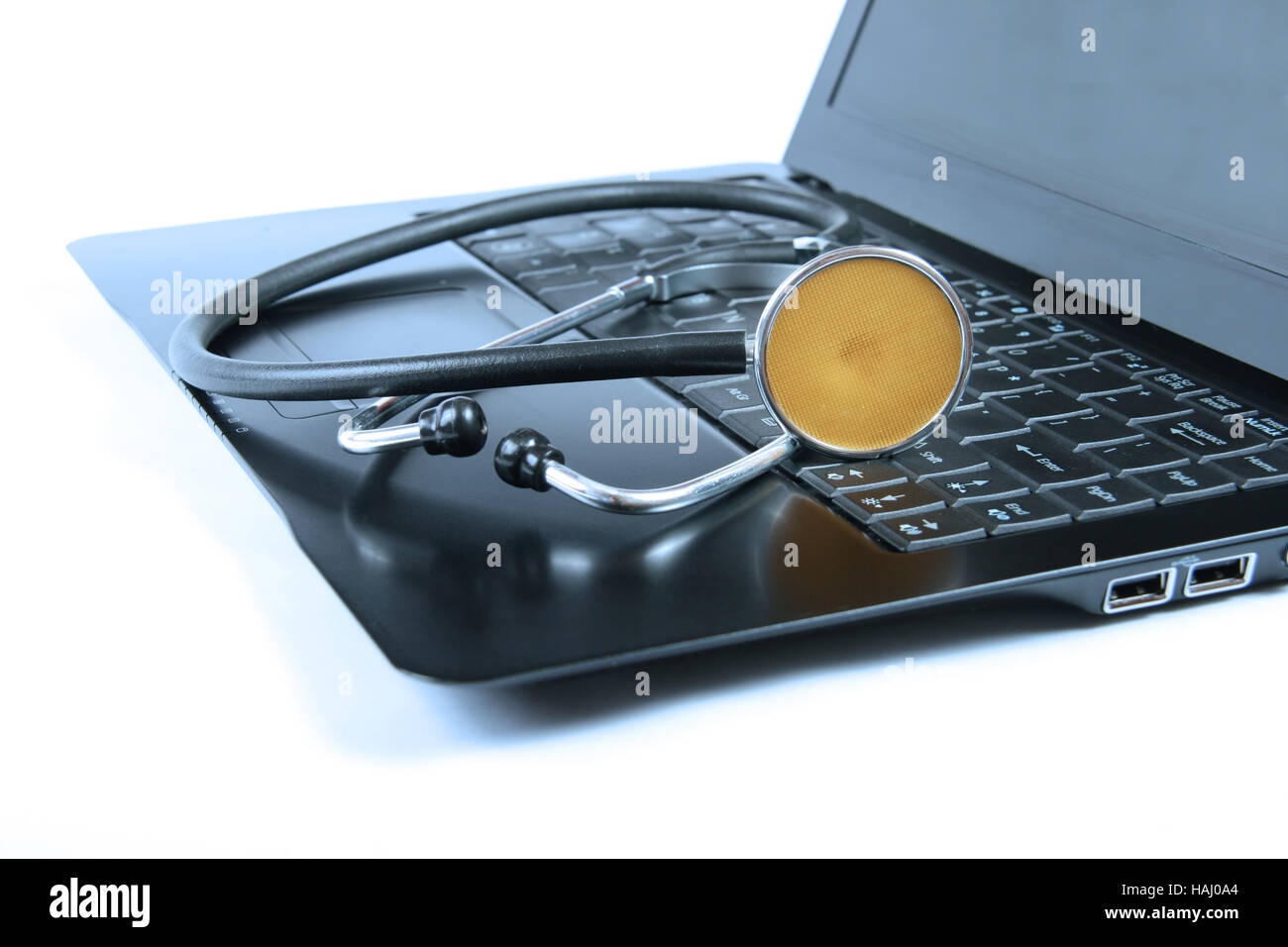 Stethoscope on a laptop keyboard Stock Photo