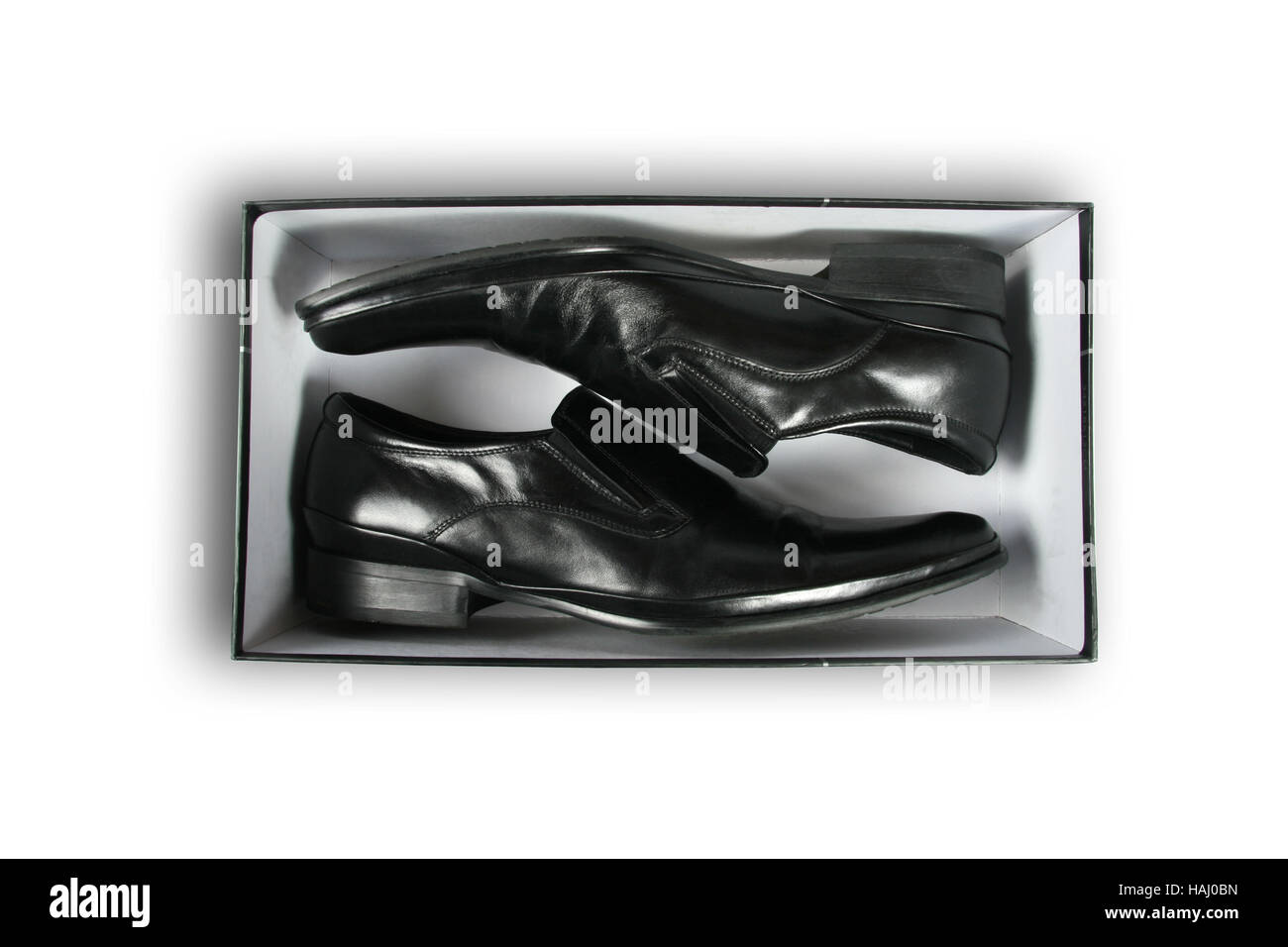 Pair of black leather shoes inside a box Stock Photo