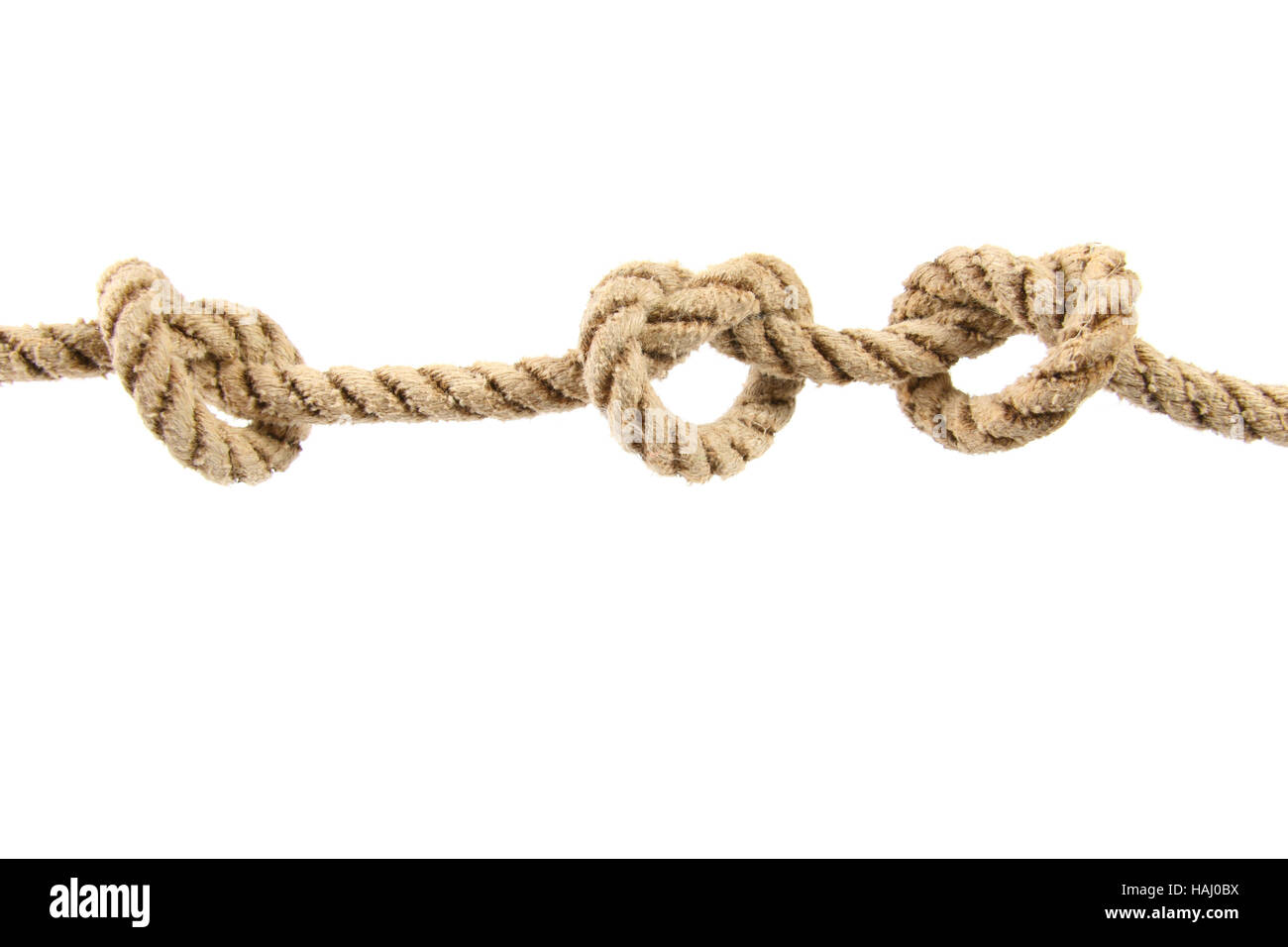 Rope with three knots isolated on white Stock Photo