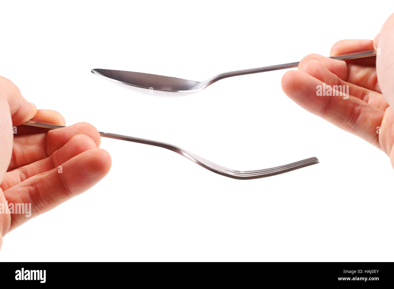 Fork and spoon in hands Stock Photo Alamy
