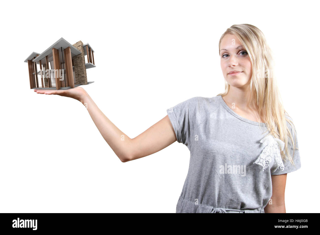 Concept of real estate business: woman with house on the hand Stock Photo