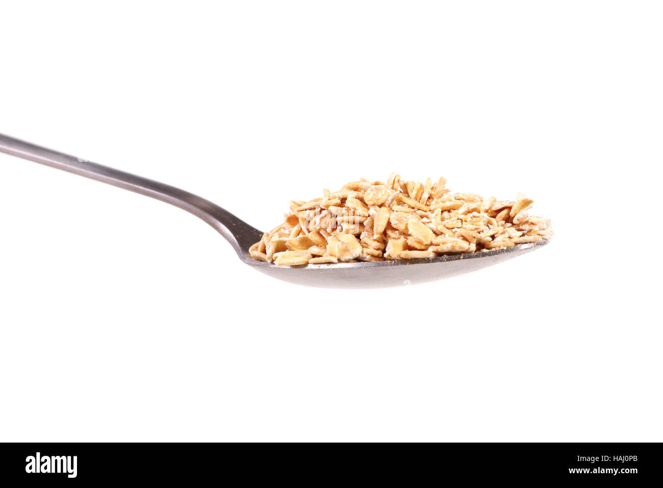 rolled oats in spoon Stock Photo